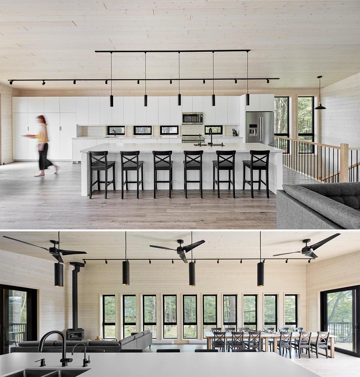 This modern kitchen includes all-white cabinets that are contrasted by the black lighting and black stools at the large island.