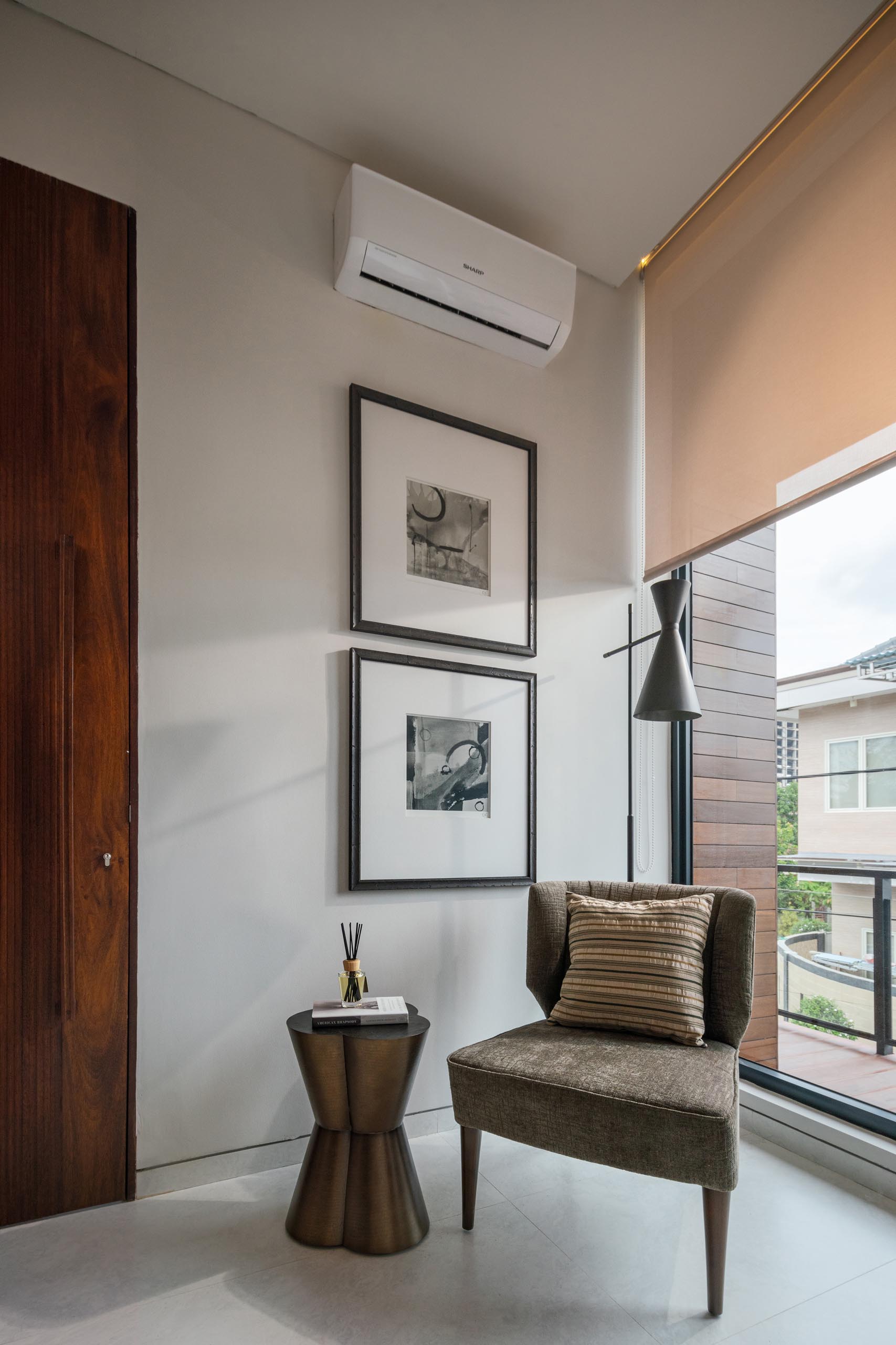 A home office with a small sitting area.