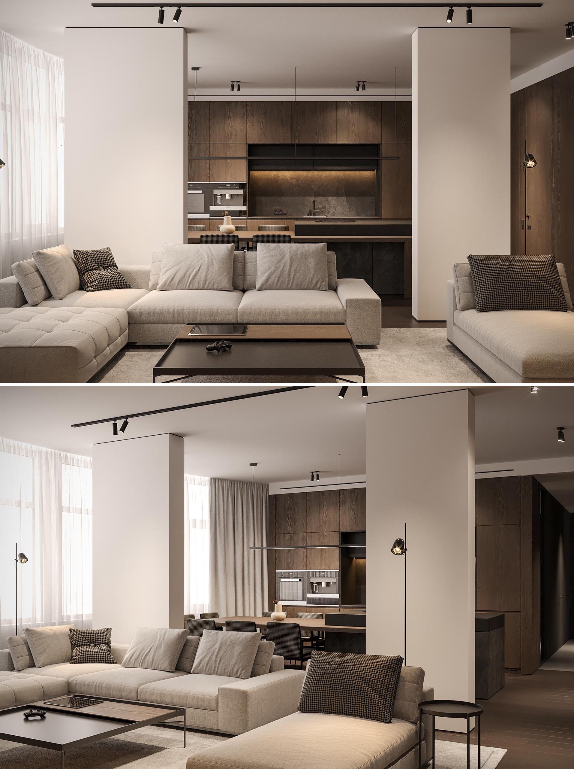 In this modern living room, modular furniture creates multiple seating areas, and the TV shelf is highlighted by lighting, similar to that in the bedrooms.