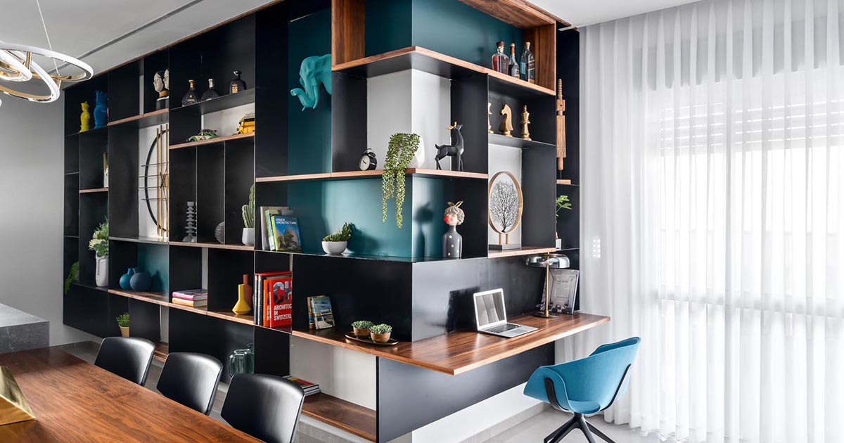 A Small Desk Was Included In This Wrap Around Wall Of Shelving Designed To Show Off Decor Pieces