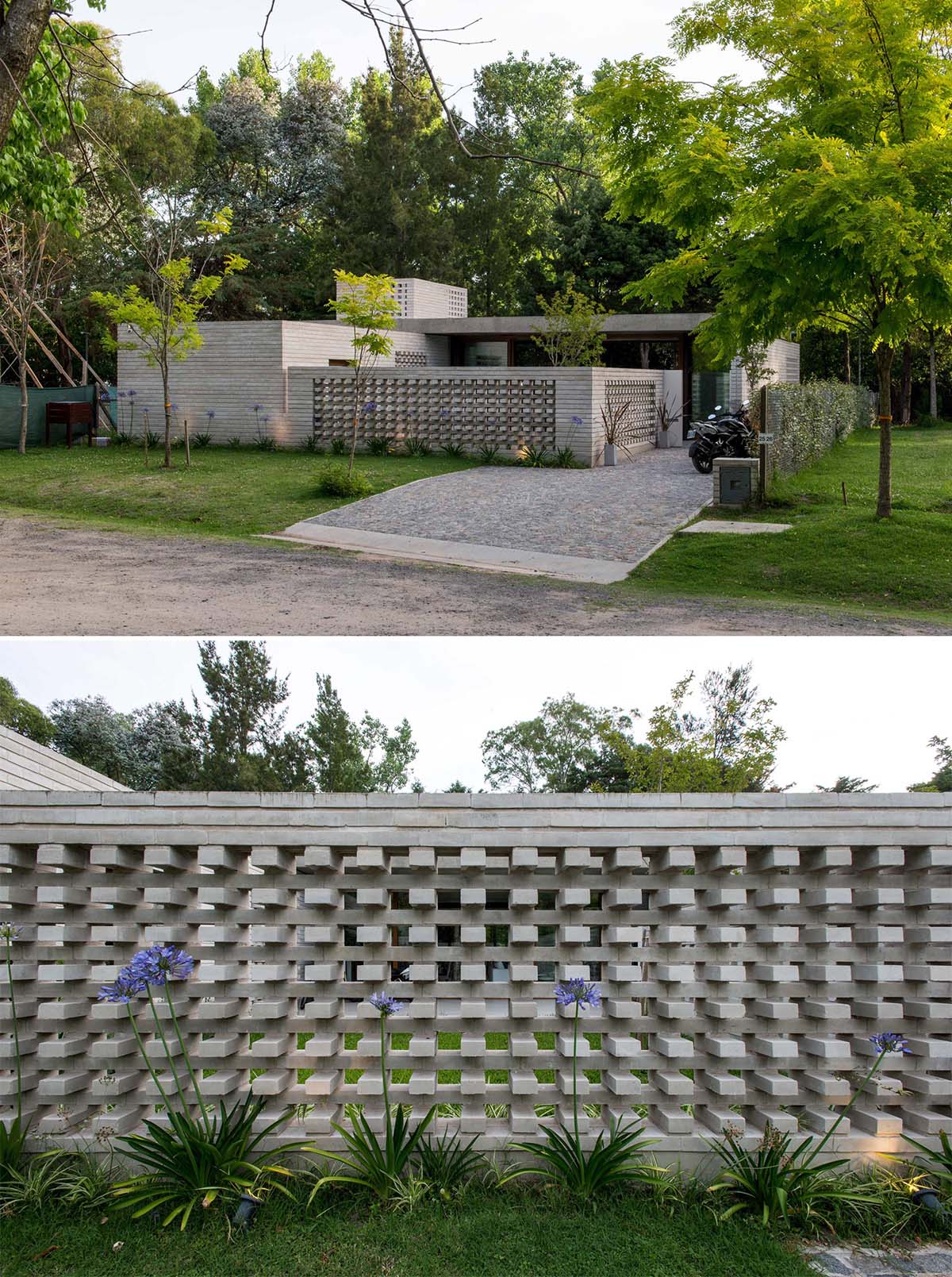 A concrete block wall that provides privacy for a modern home.