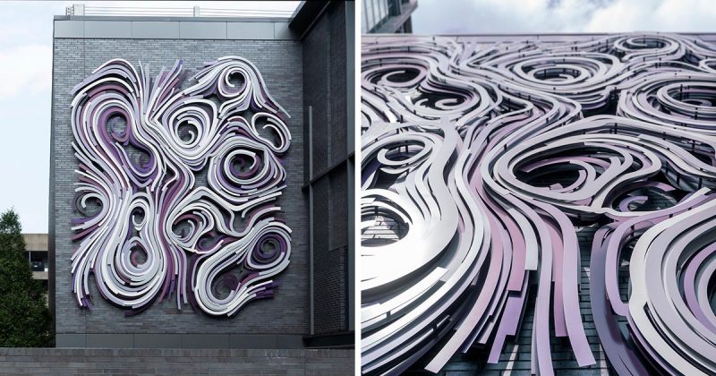 A large art installation on the side of a building.