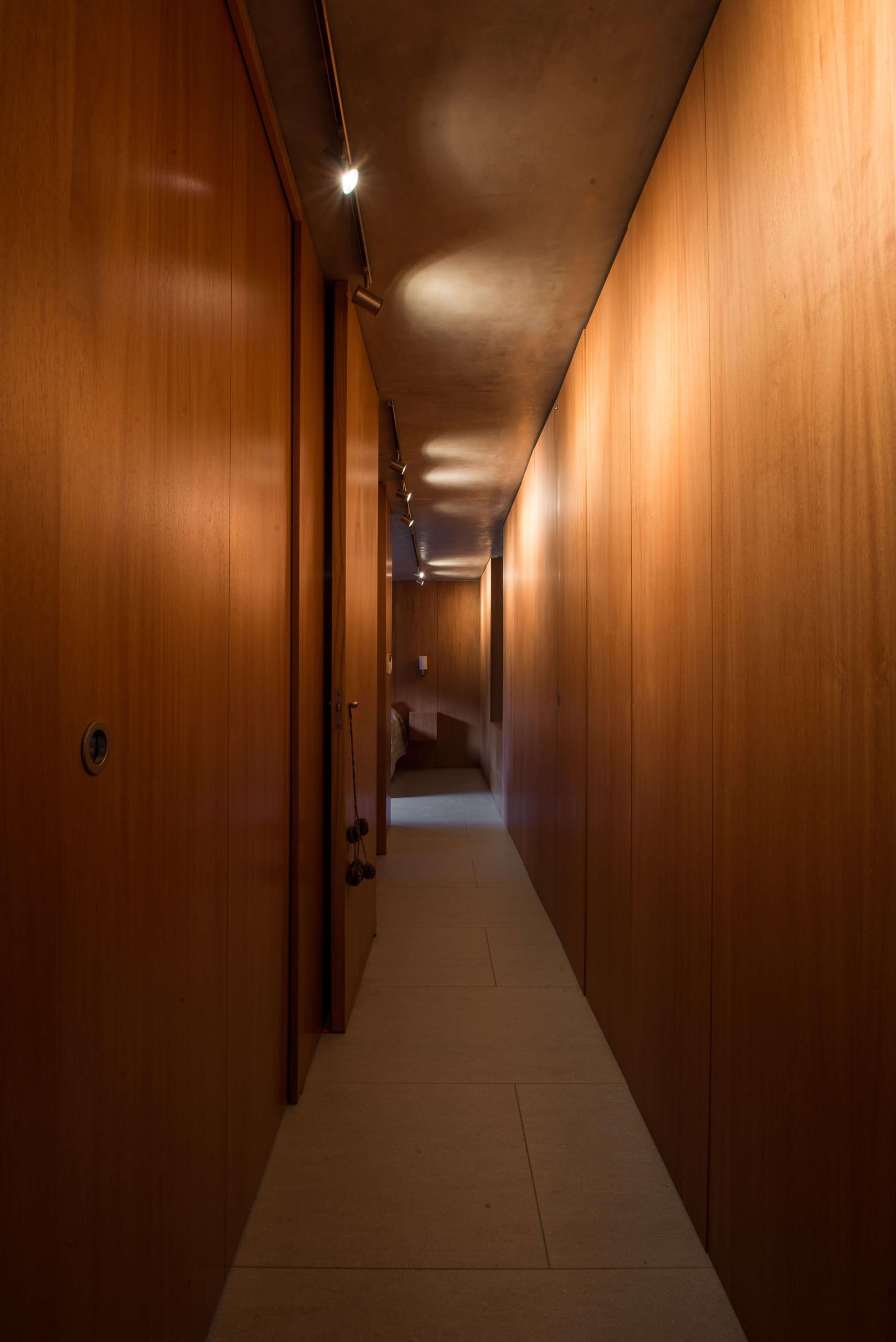 A wood lined hallway.