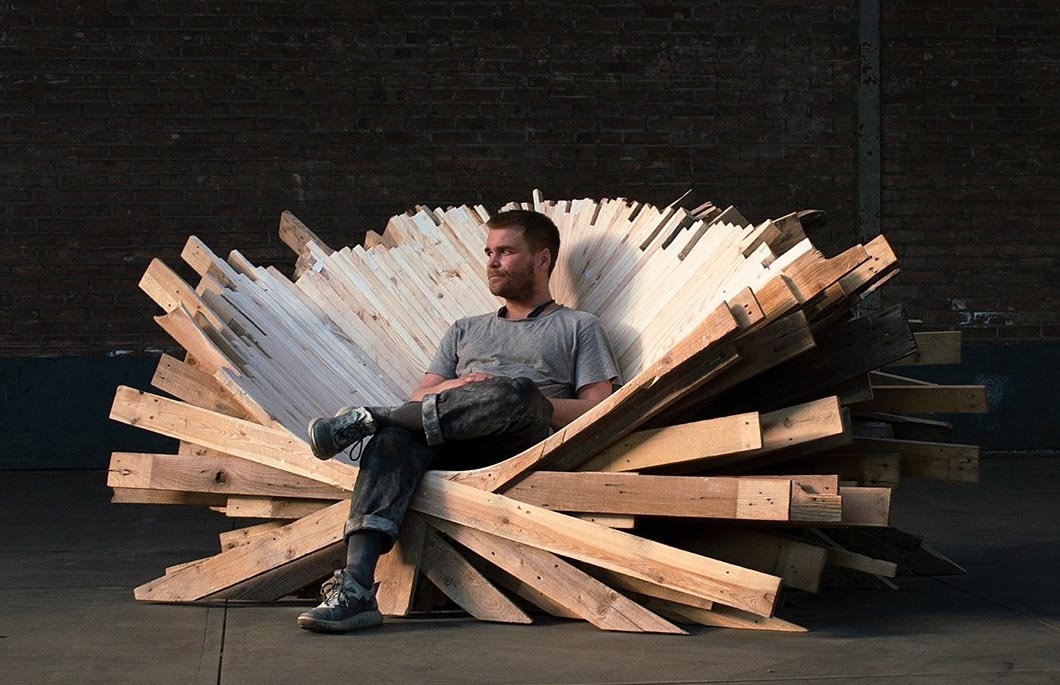 An oversized and sculptural chair made from recycled pallets.