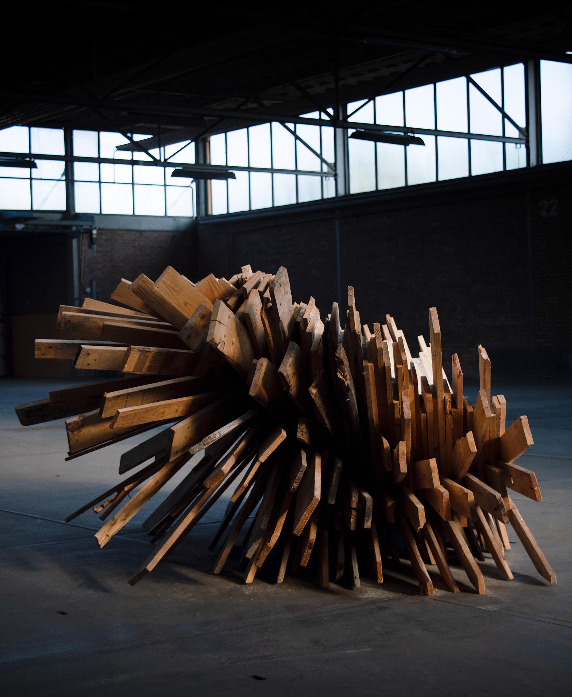 An oversized and sculptural chair made from recycled pallets.