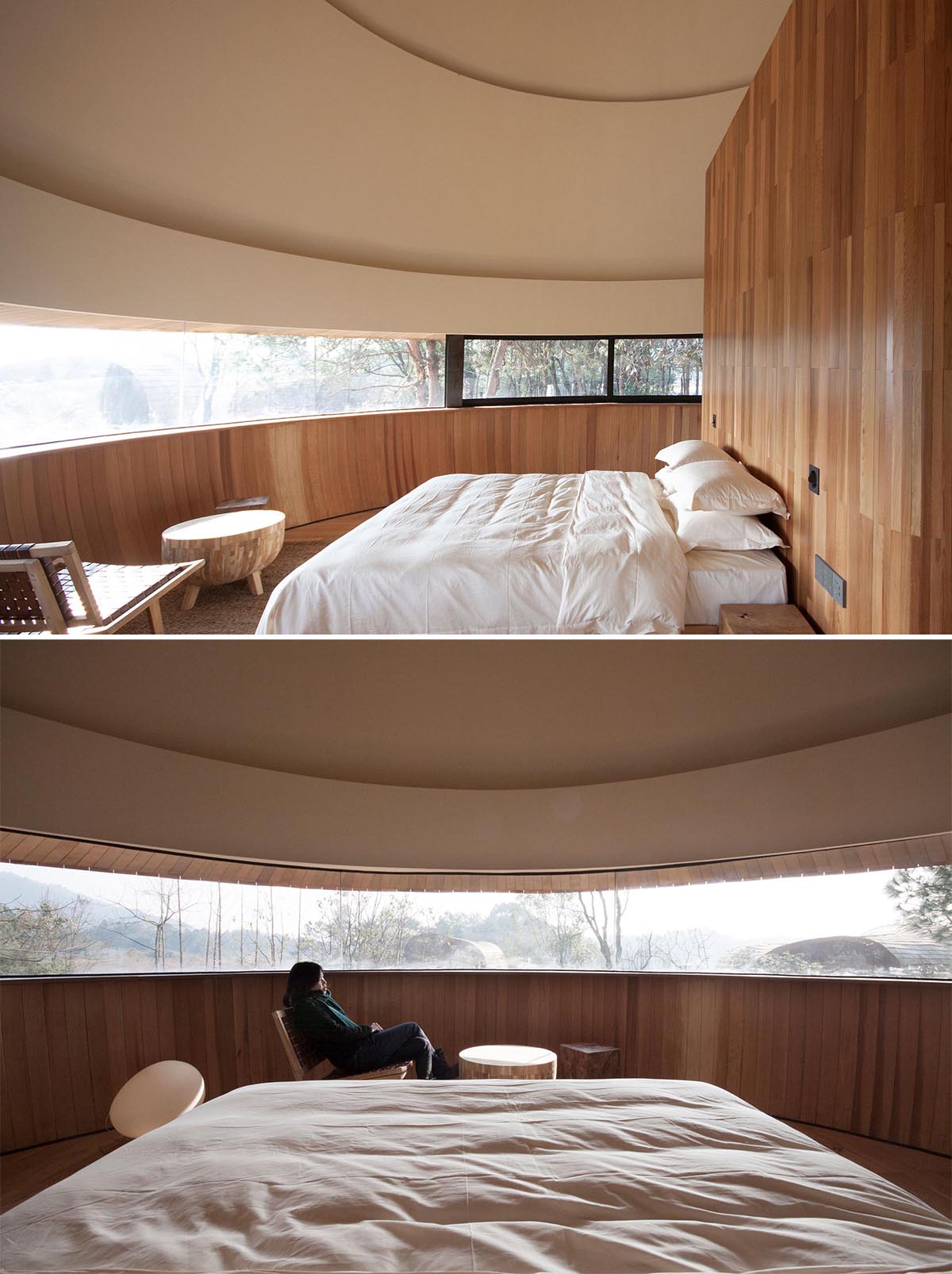 Inside this modern cabin, there's a bedroom that's designed to take advantage of the panoramic window that's curved to the shape of the wall. 