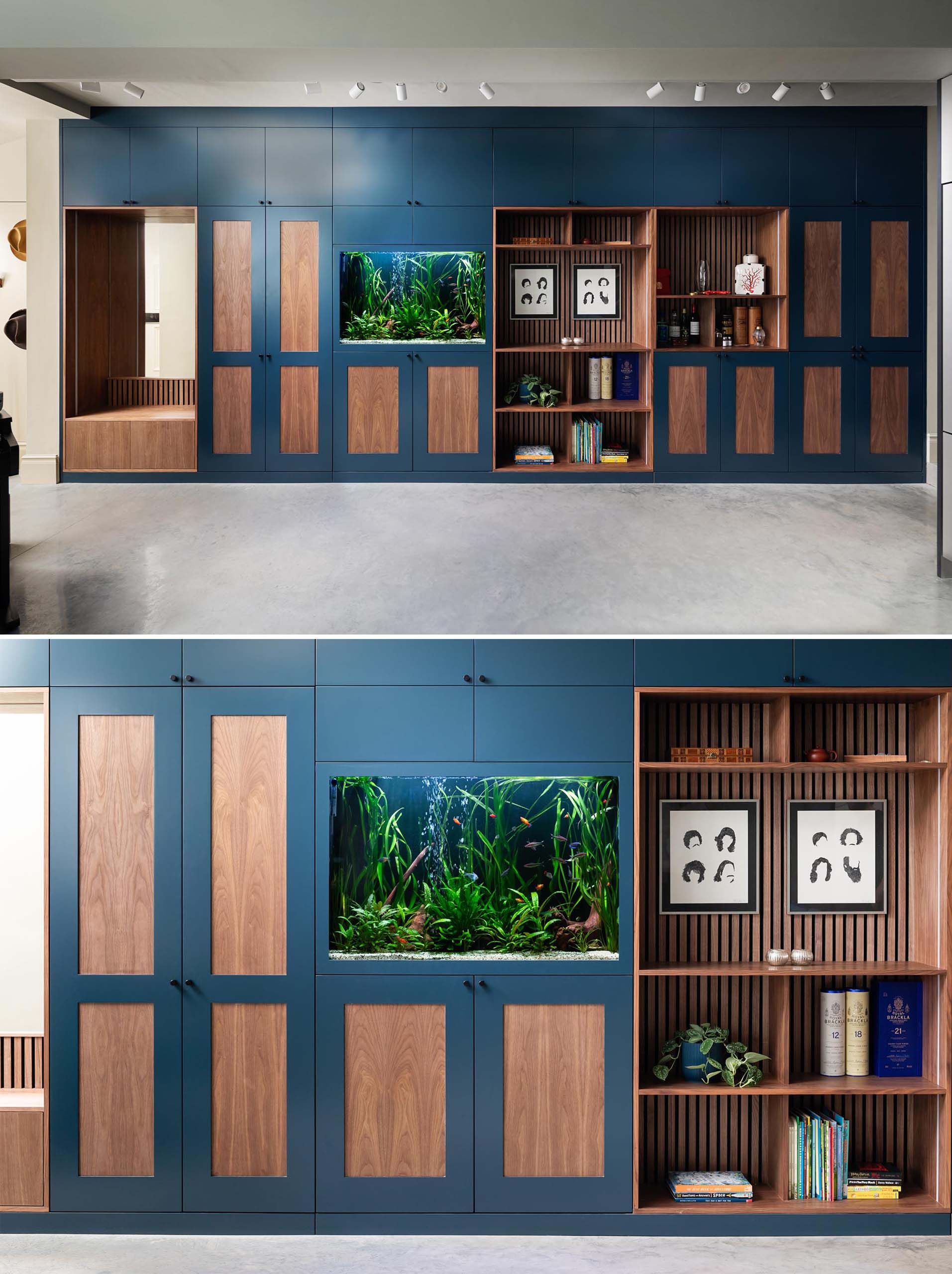 An entire wall of dark blue and wood cabinetry that includes a bench with a mirror, plenty of storage, a fish tank, open shelving, and an integrated coffee station.