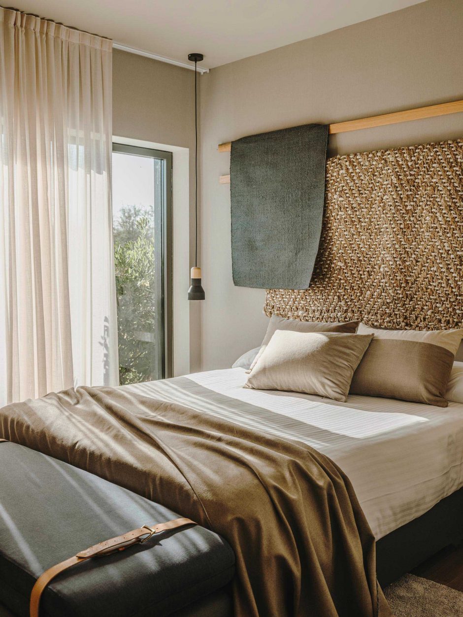 Draped Natural Fabrics Create A Unique Textural Decorative Element On This Bedroom Wall