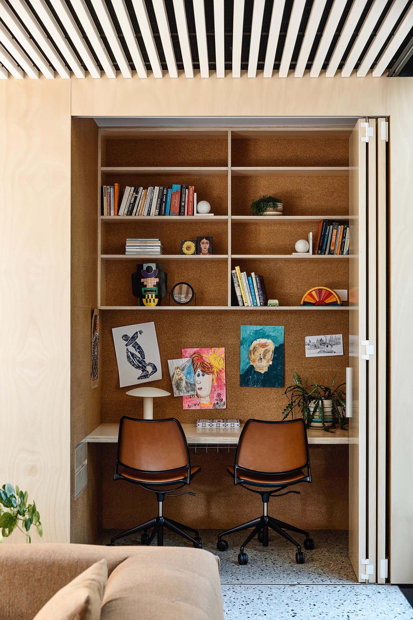 This modern home has a small home office / homework station that's been tucked within a closet, making it easily accessible, and at the same time, can be hidden from when not in use.