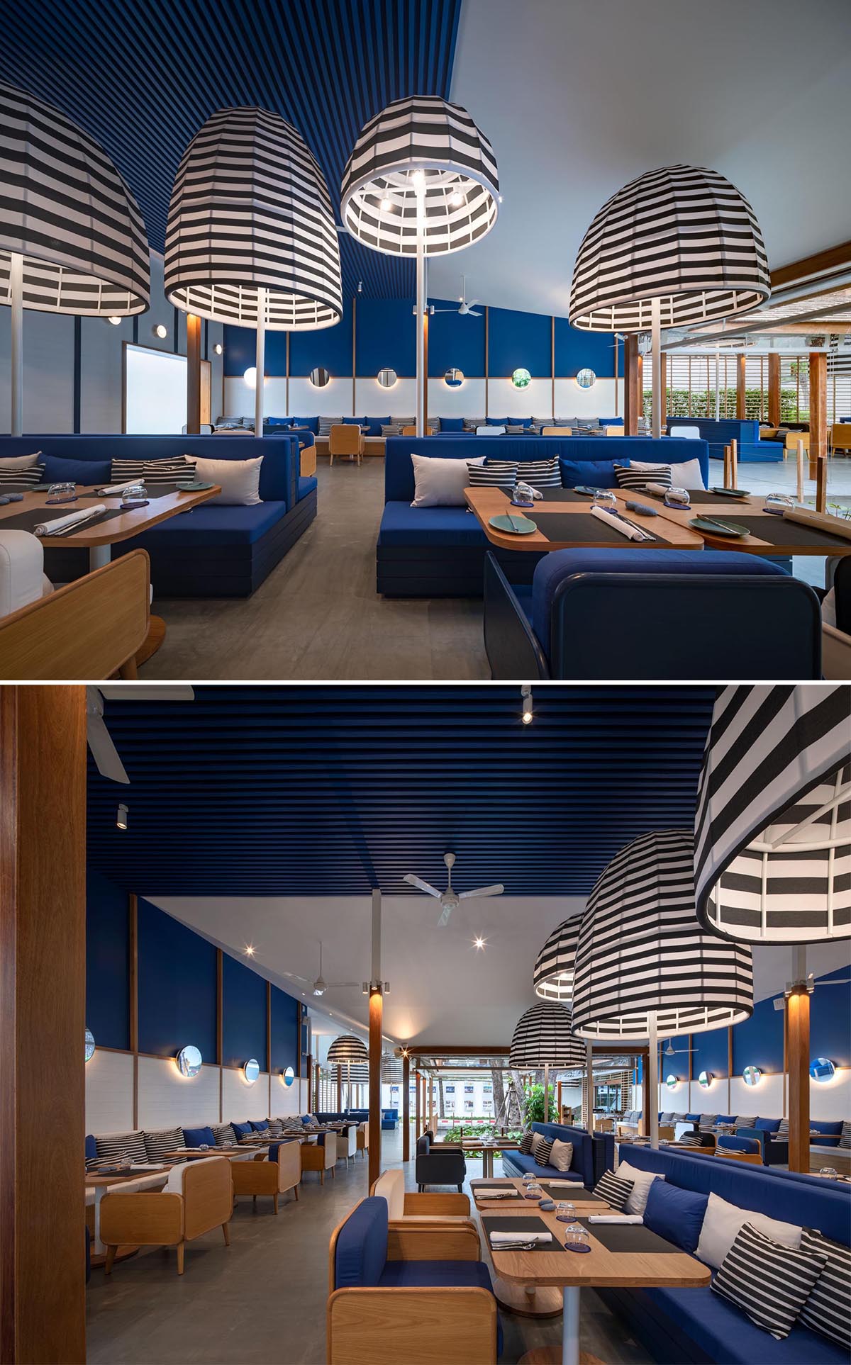 A modern hotel restaurant with a blue and white theme, as well as black and white striped accents.