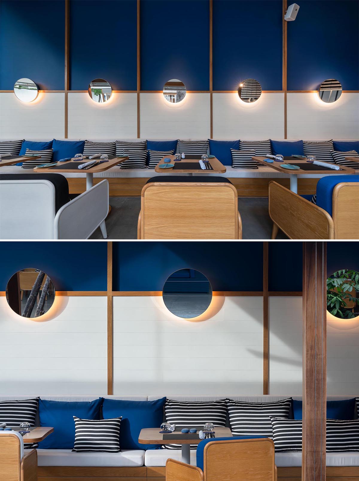 A modern hotel restaurant with a blue and white theme, as well as black and white striped accents.