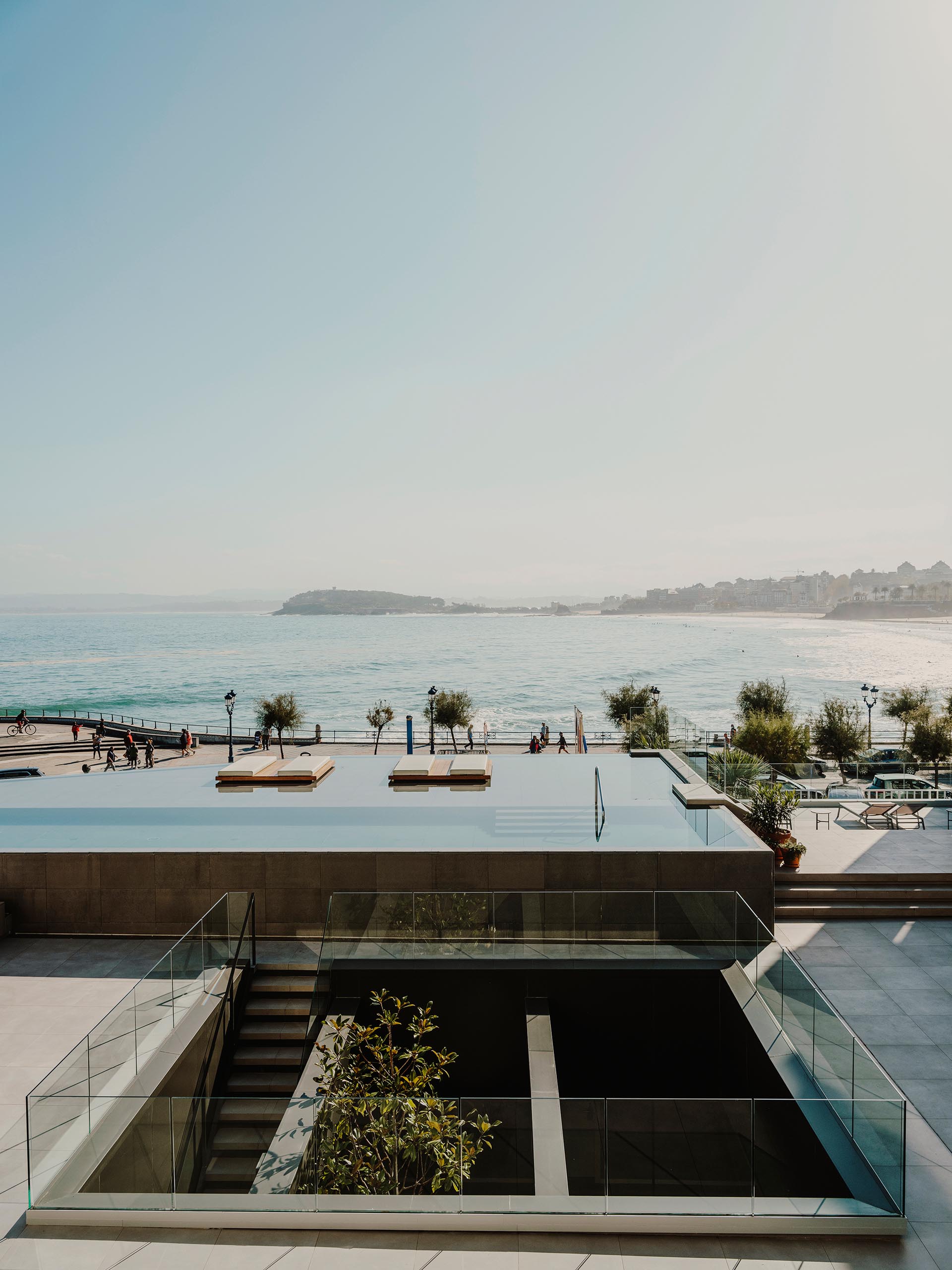 A modern hotel in Spain with a variety of levels dedicated to outdoor spaces and an infinity edge swimming pool.