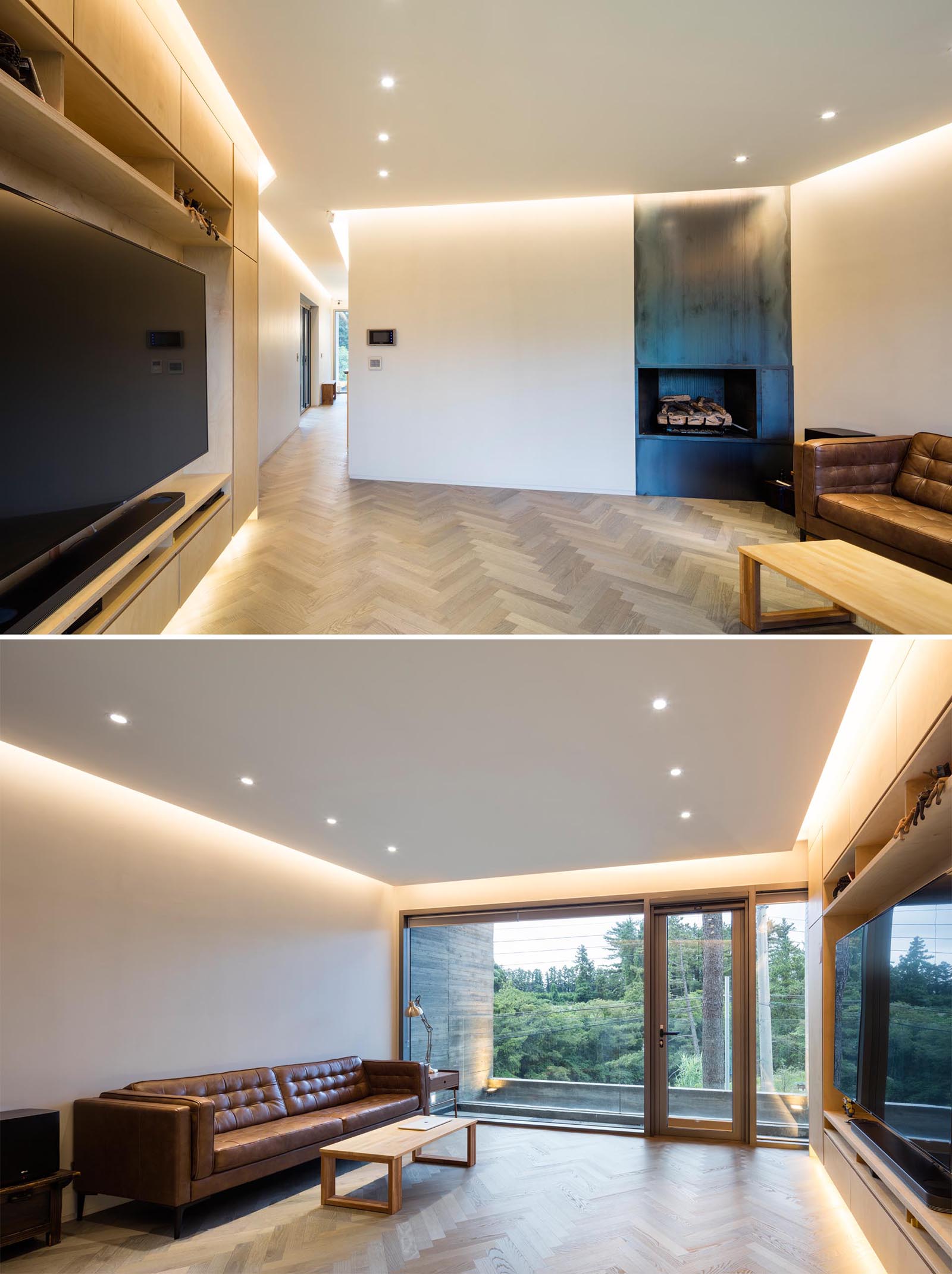 A modern living room with white walls and ceilings, wood flooring, and hidden lighting. 