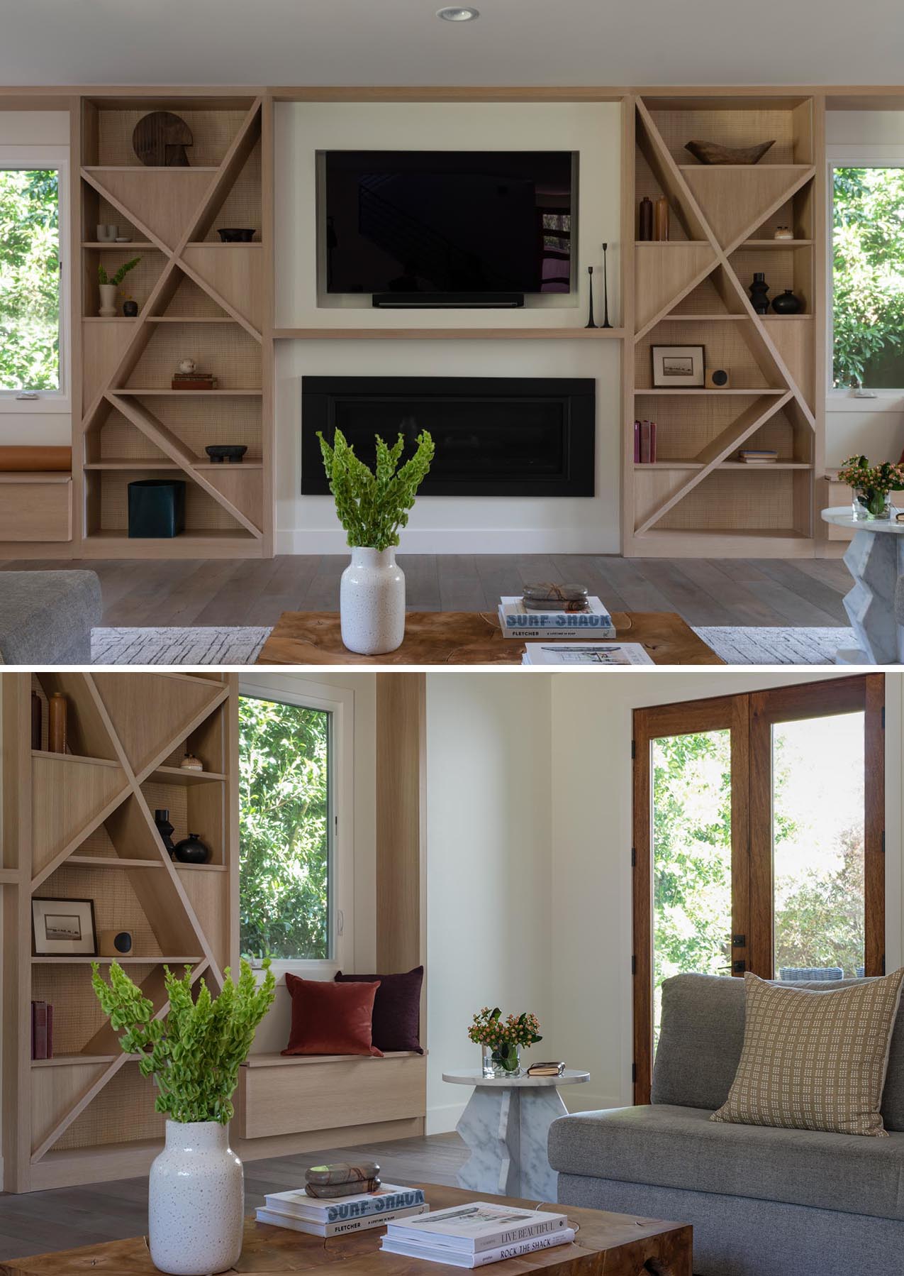 A modern living room with a custom designed wall that includes a recessed TV, a fireplace, wood shelving, and a pair of window seats.