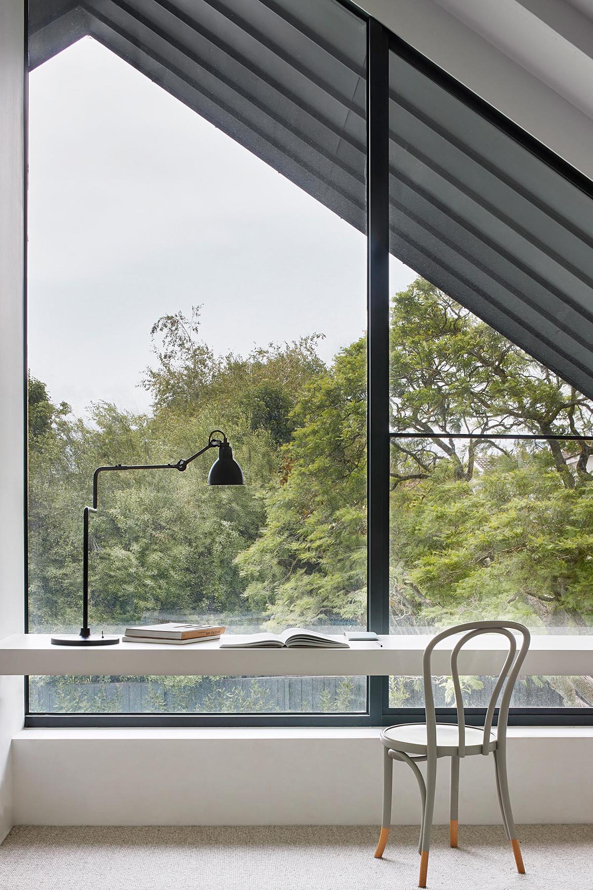 A built-in desk makes use of the natural light from the windows.