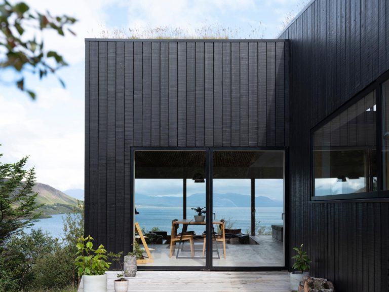 The Green Roof On This Home Helps It Blend Into The Surrounding Landscape