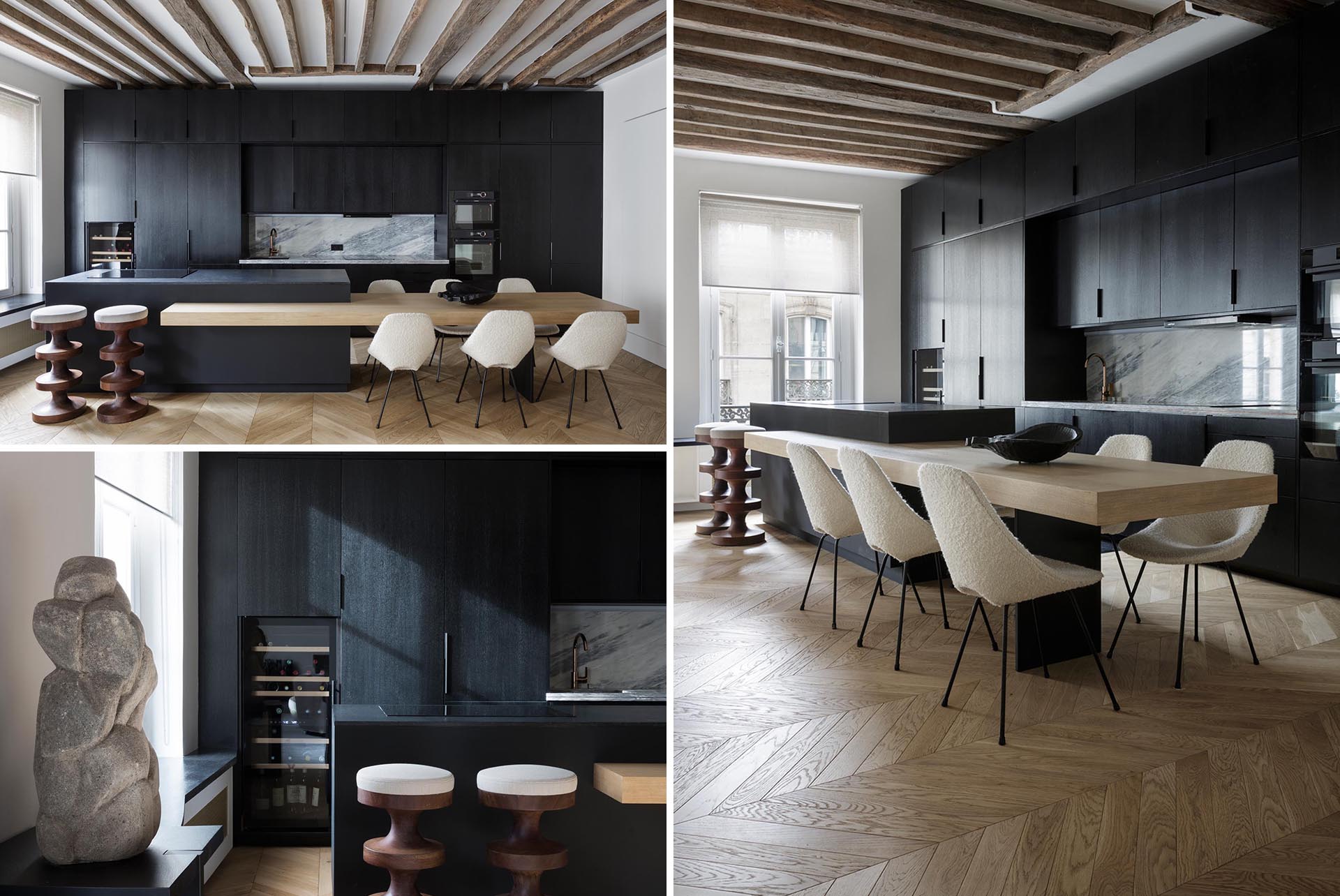 A modern apartment with a matte black kitchen and built-in dining table.