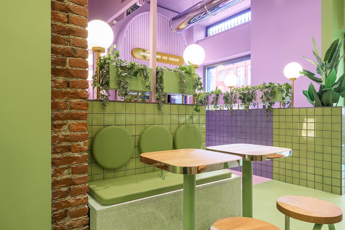 A new restaurant uses a colorful green and purple interior to draw people inside.