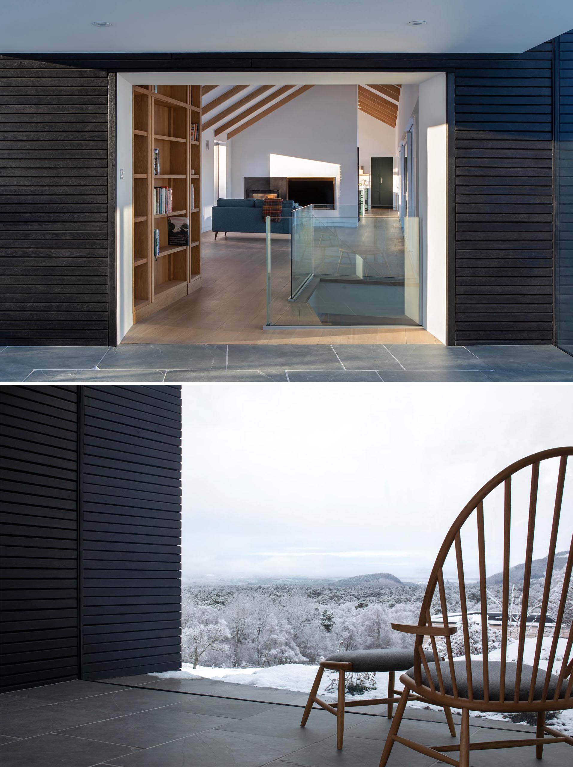 A glass-lined hallway connects an addition to the original home.