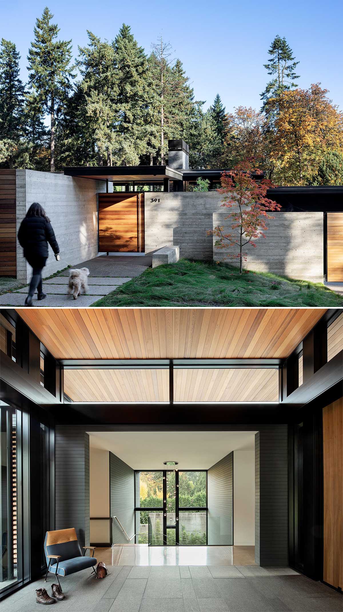 A modern home with a concrete wall and wood front door.