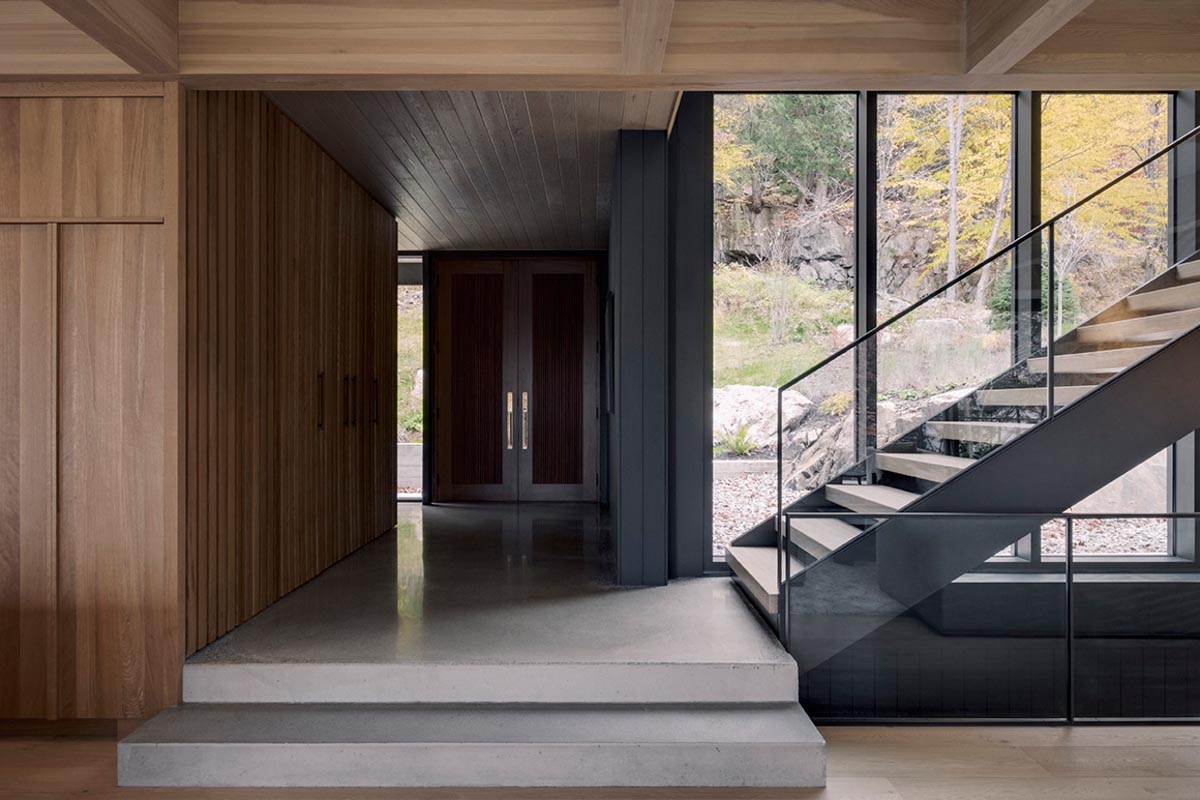 Stepping inside the home and there's polished concrete flooring and warm wood details.