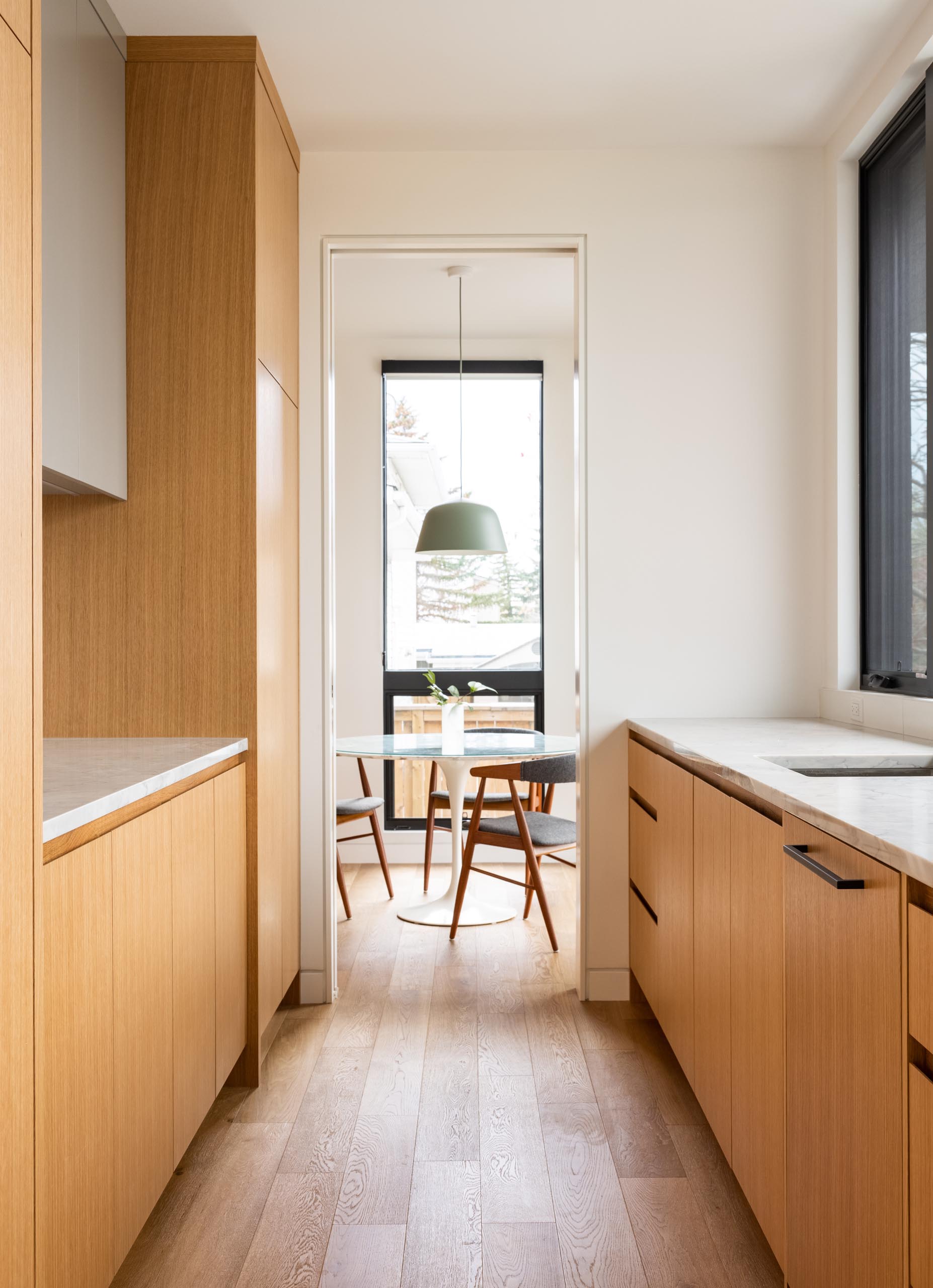 A small breakfast area is located off the kitchen, while a walk-through pantry connects with the main dining room.