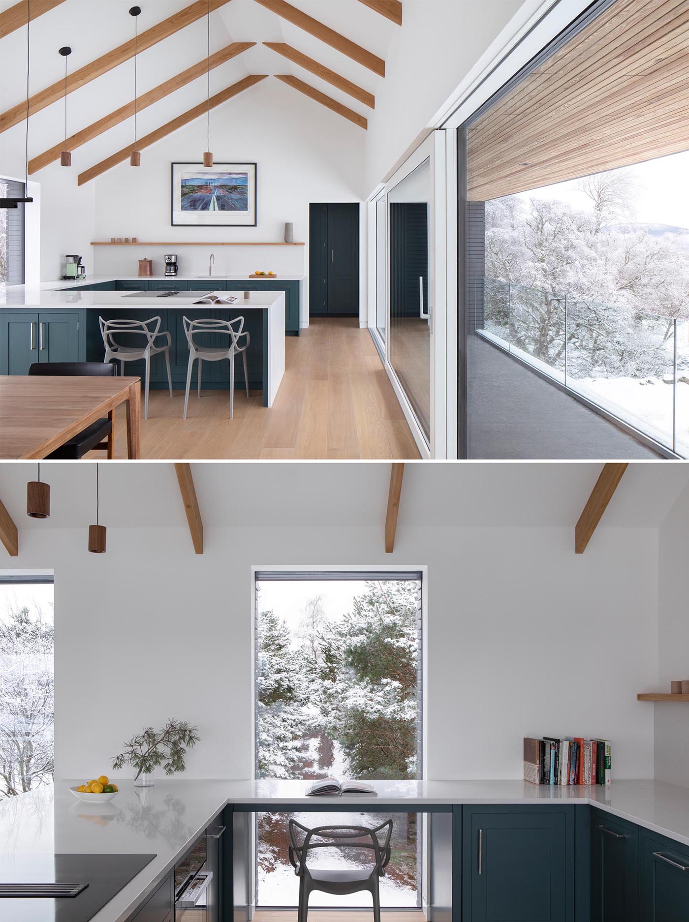 A modern kitchen includes colorful lower cabinets, a countertop with waterfall edges, and a section that can be used as a desk.