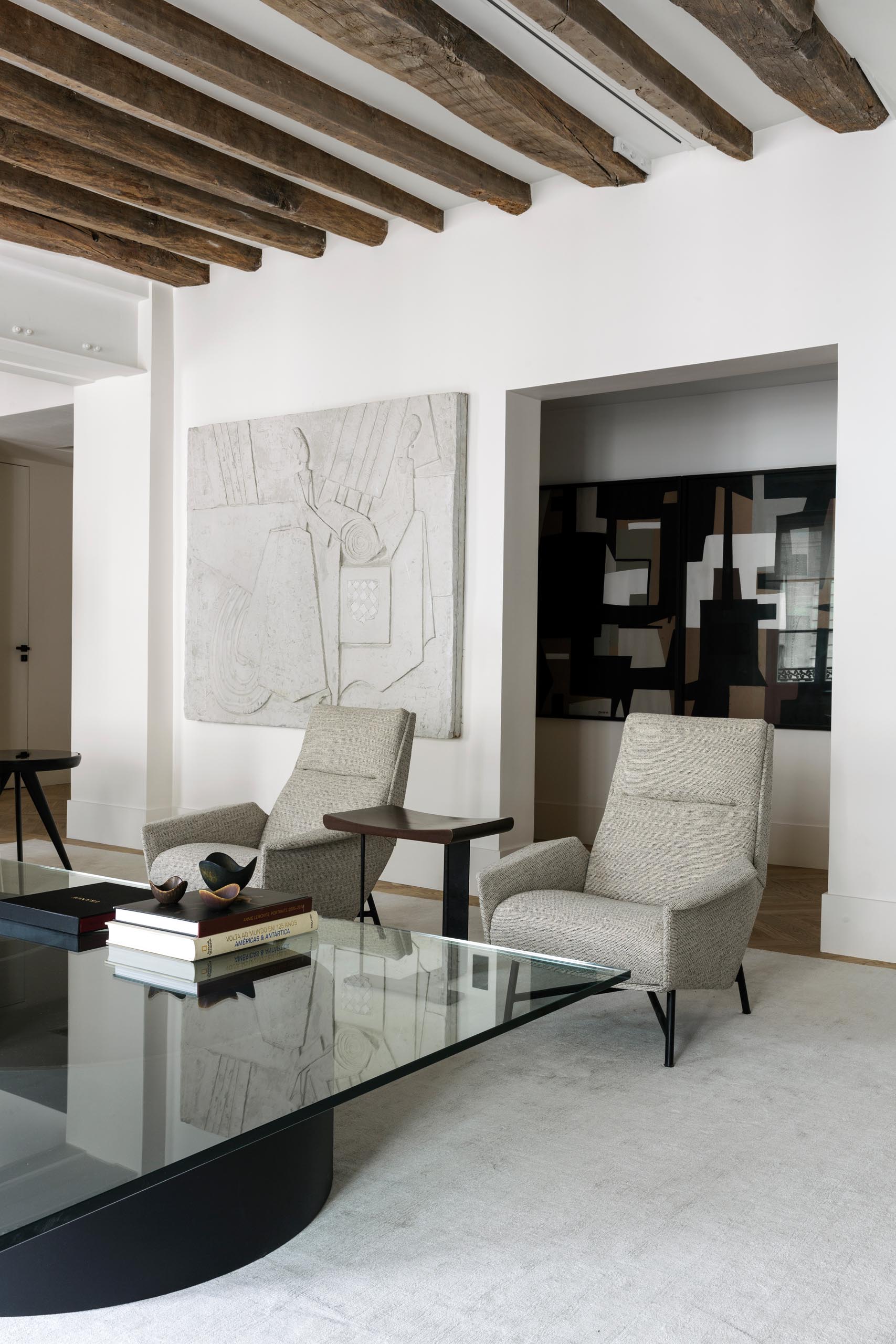 In this modern living room, neutral colored furniture creates a calm and relaxed environment.