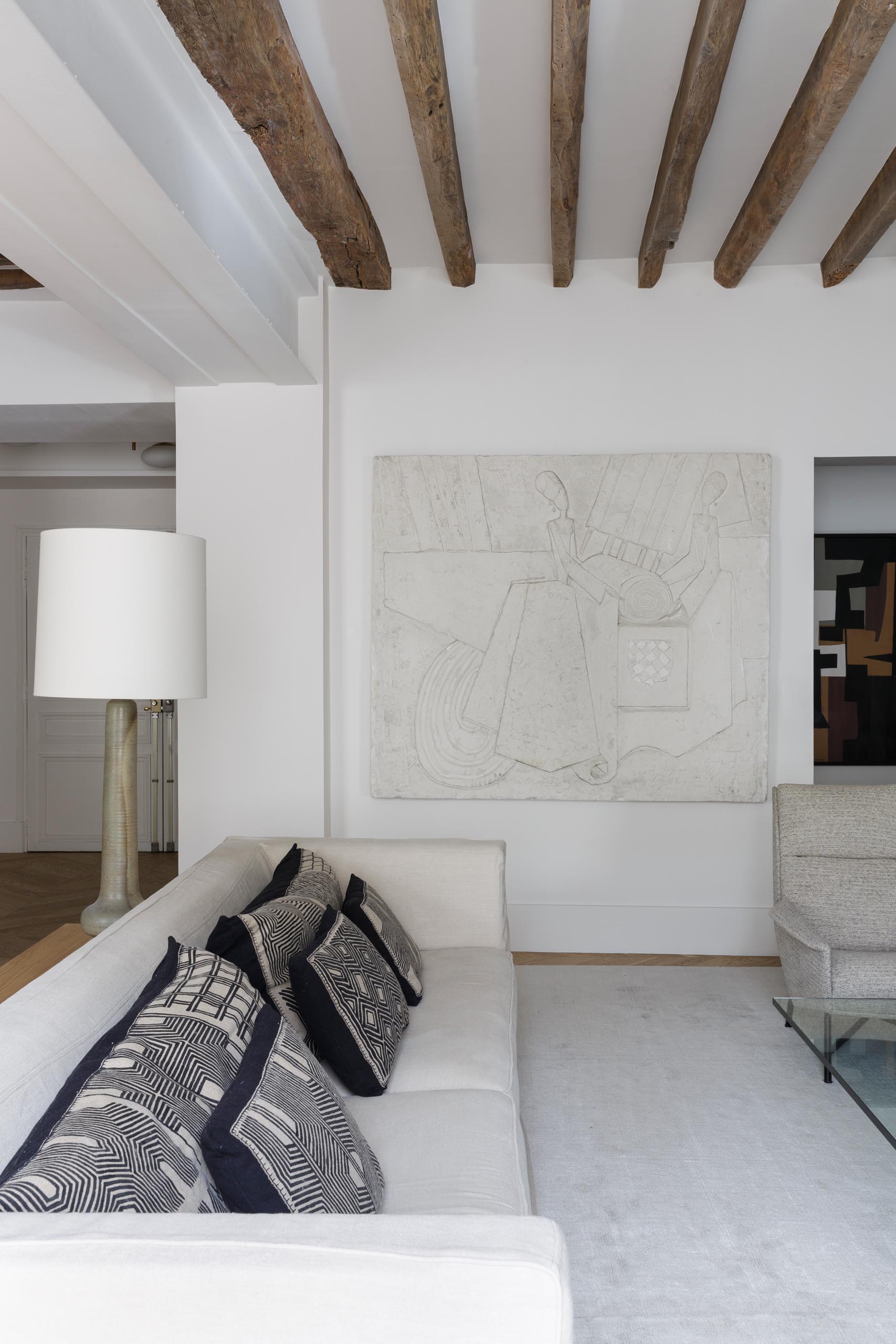 In this modern living room, neutral colored furniture creates a calm and relaxed environment.