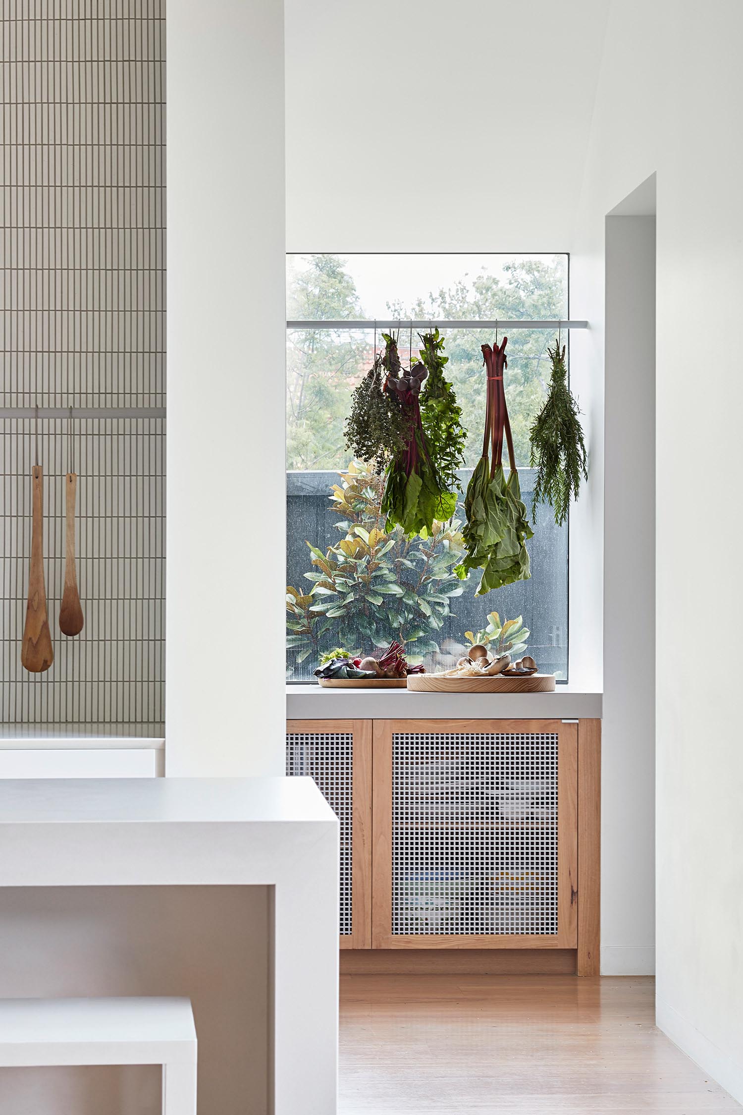 A modern kitchen with a separate pantry and preparation area.