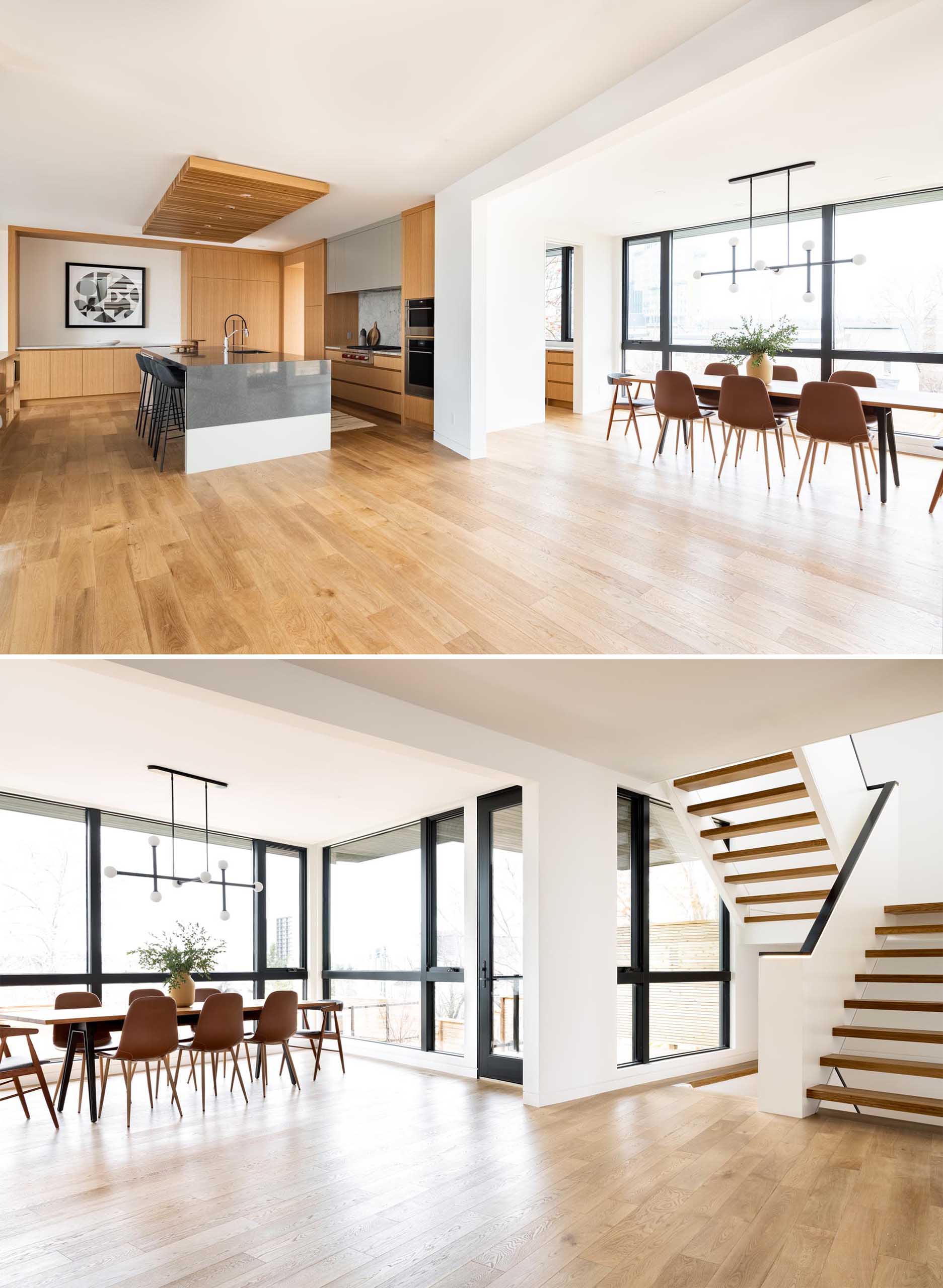 This open plan dining room is furnished with a long wood dining table with a sculptural horizontal light hanging above.