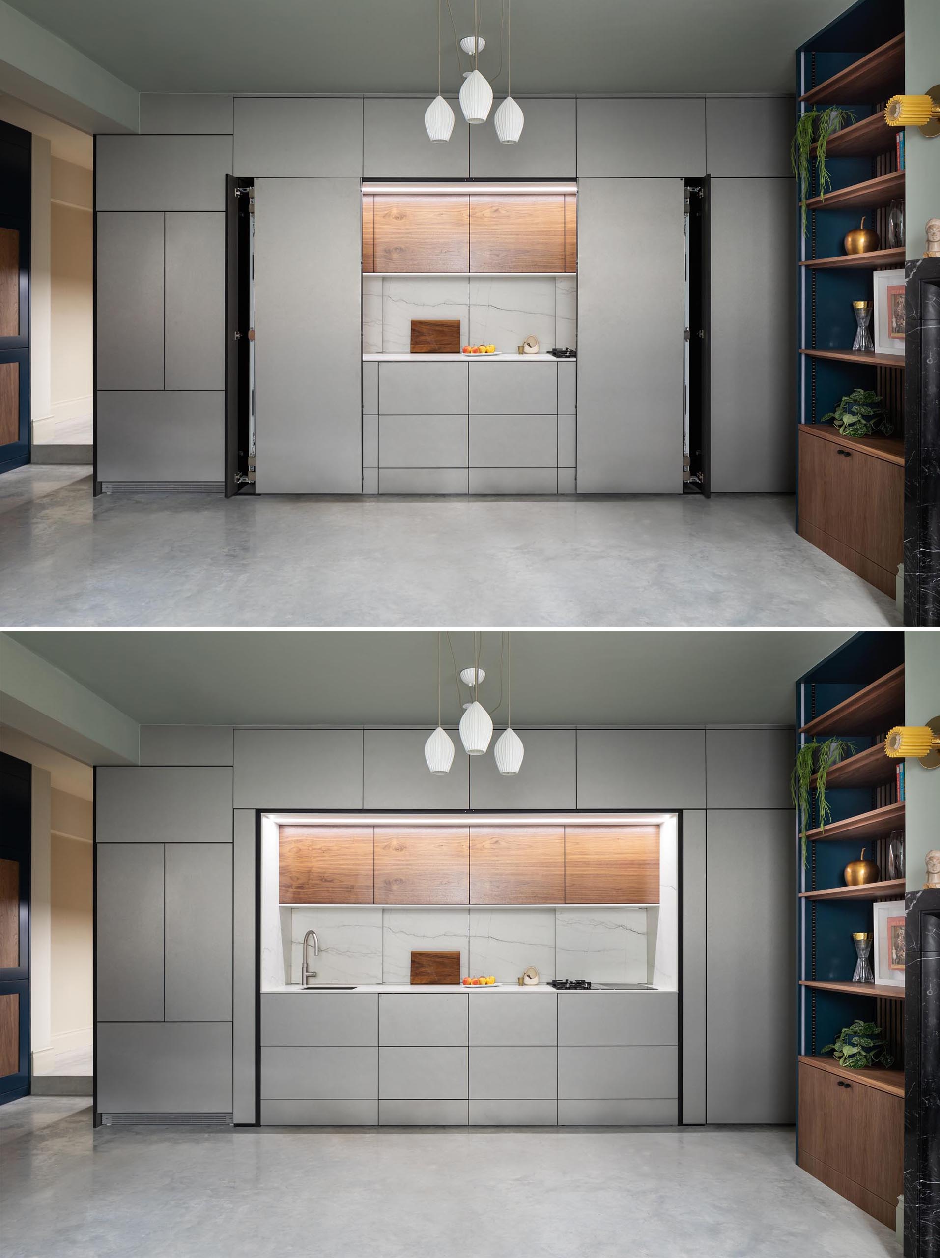 The folding doors of this modern kitchen can be completely hidden within the cabinetry.