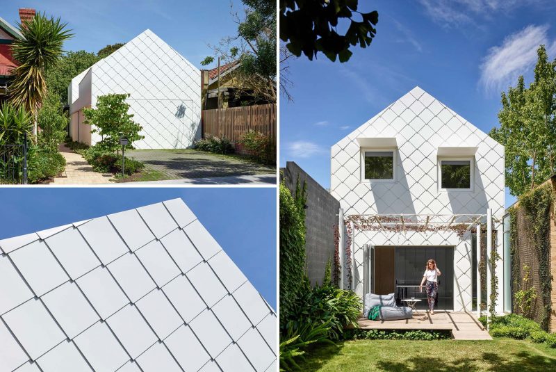 A modern home that is clad in flat lock white metal shingles.