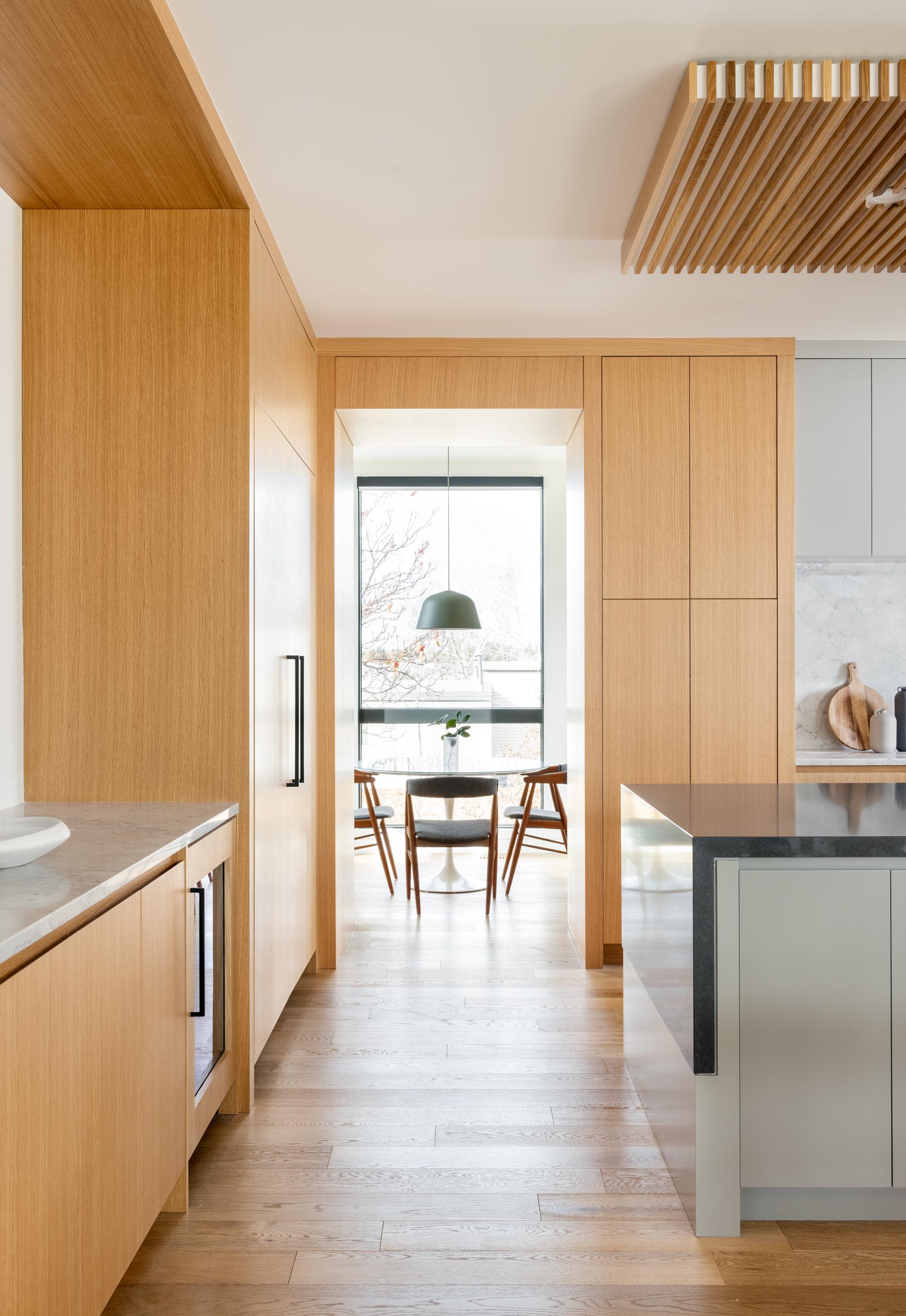 A small breakfast area is located off to the side of this modern kitchen.