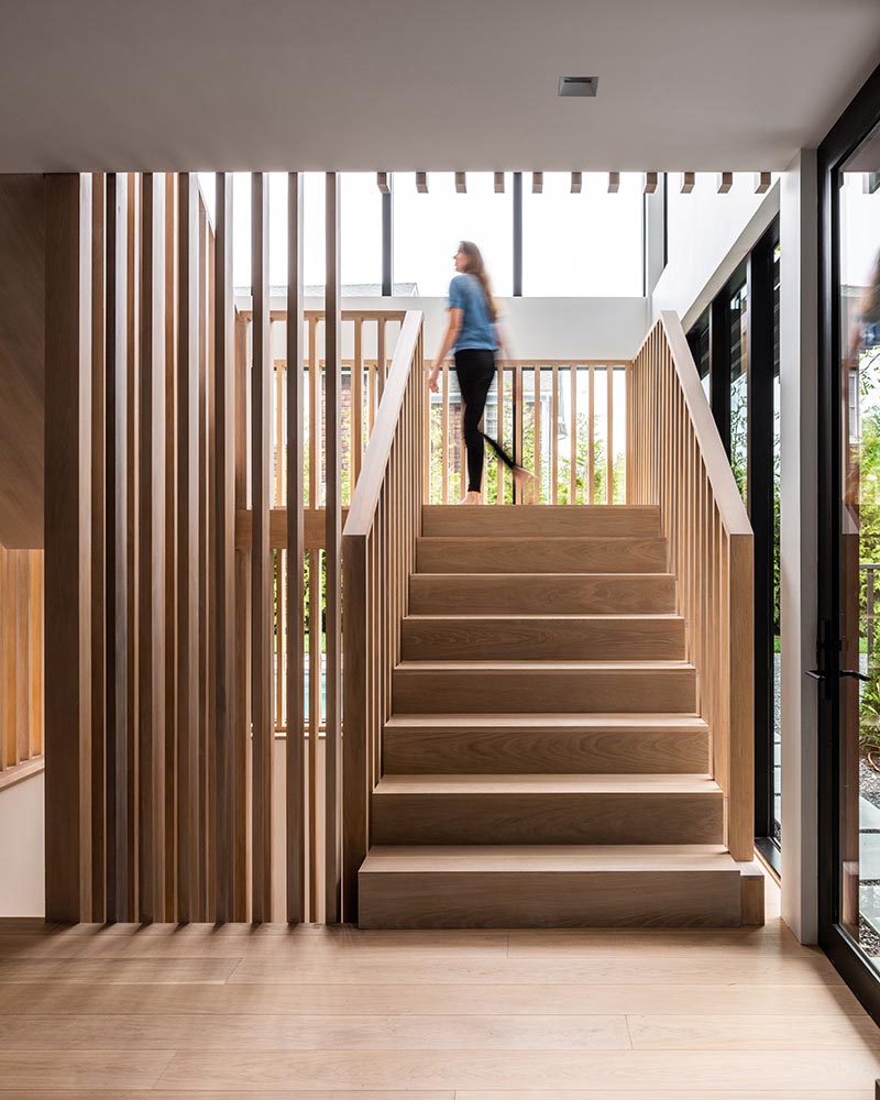 A modern home with wood stairs.