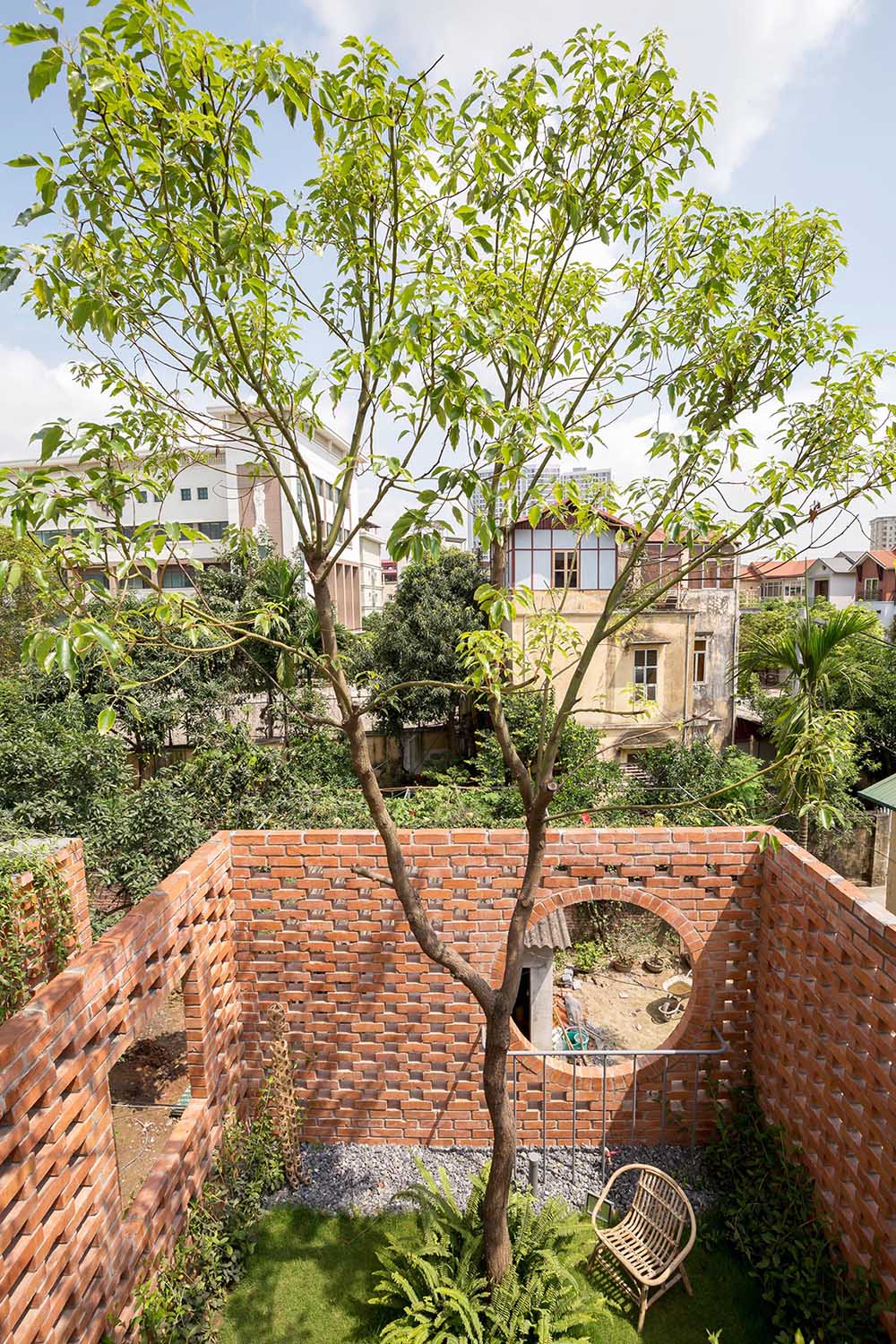 A rooftop terrace surrounded by brick.