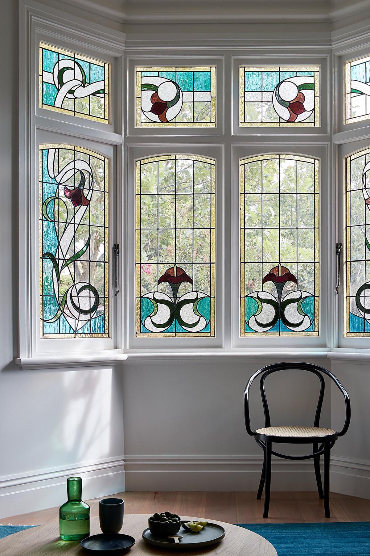 A remodeled Federation house with stained glass windows.