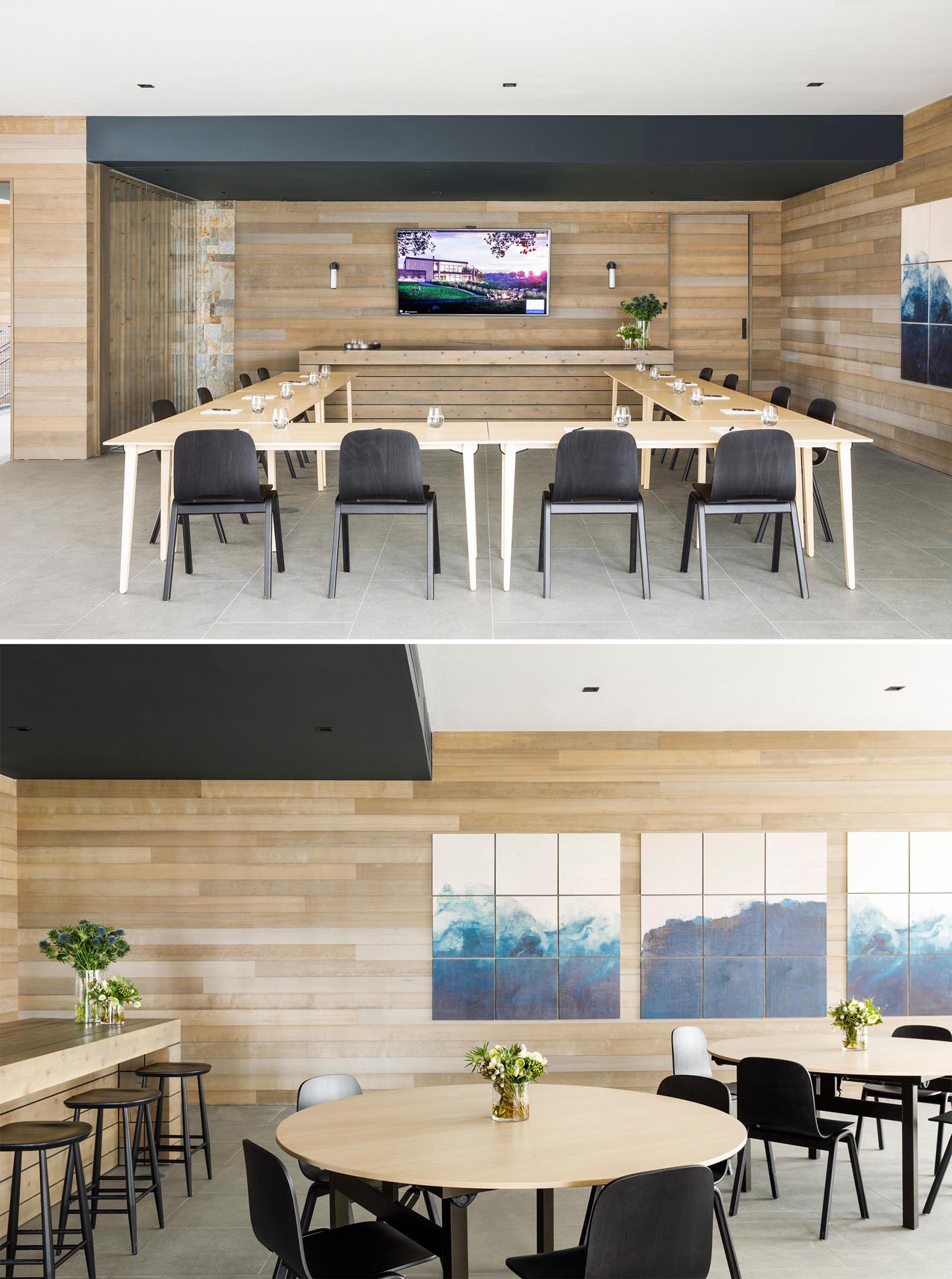 A modern conference room with tables in a U-shaped layout, as well as smaller round tables for more intimate meetings.