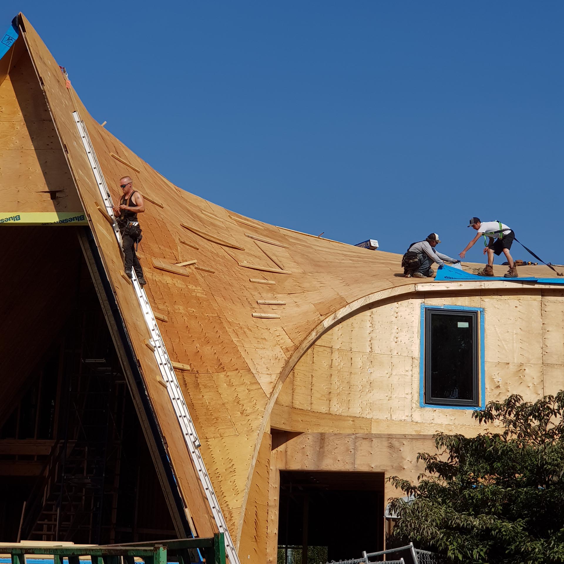 The building of a curved roof.