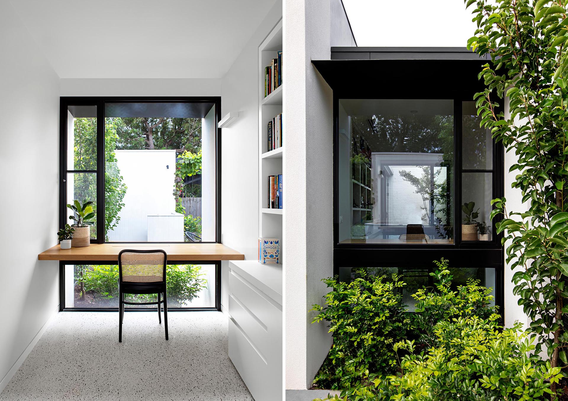 A modern home office with a solid oak wood desk that takes advantage of the window views.