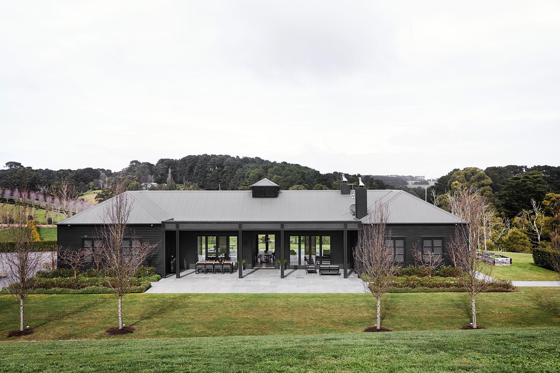 A modern farmhouse inspired home with a dark exterior.