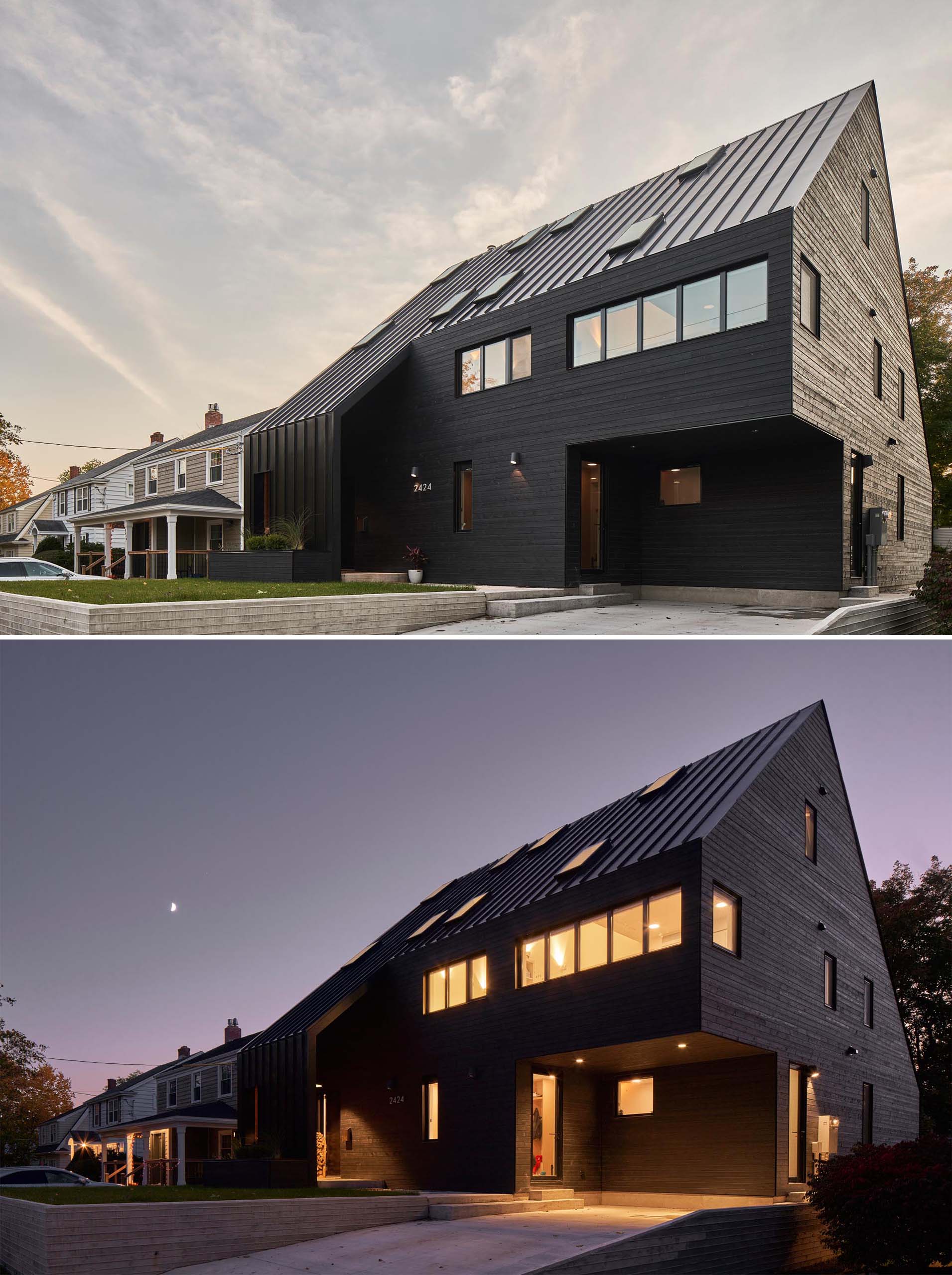 A modern black house with wood siding and a standing seam metal roof, as well as black window frames.