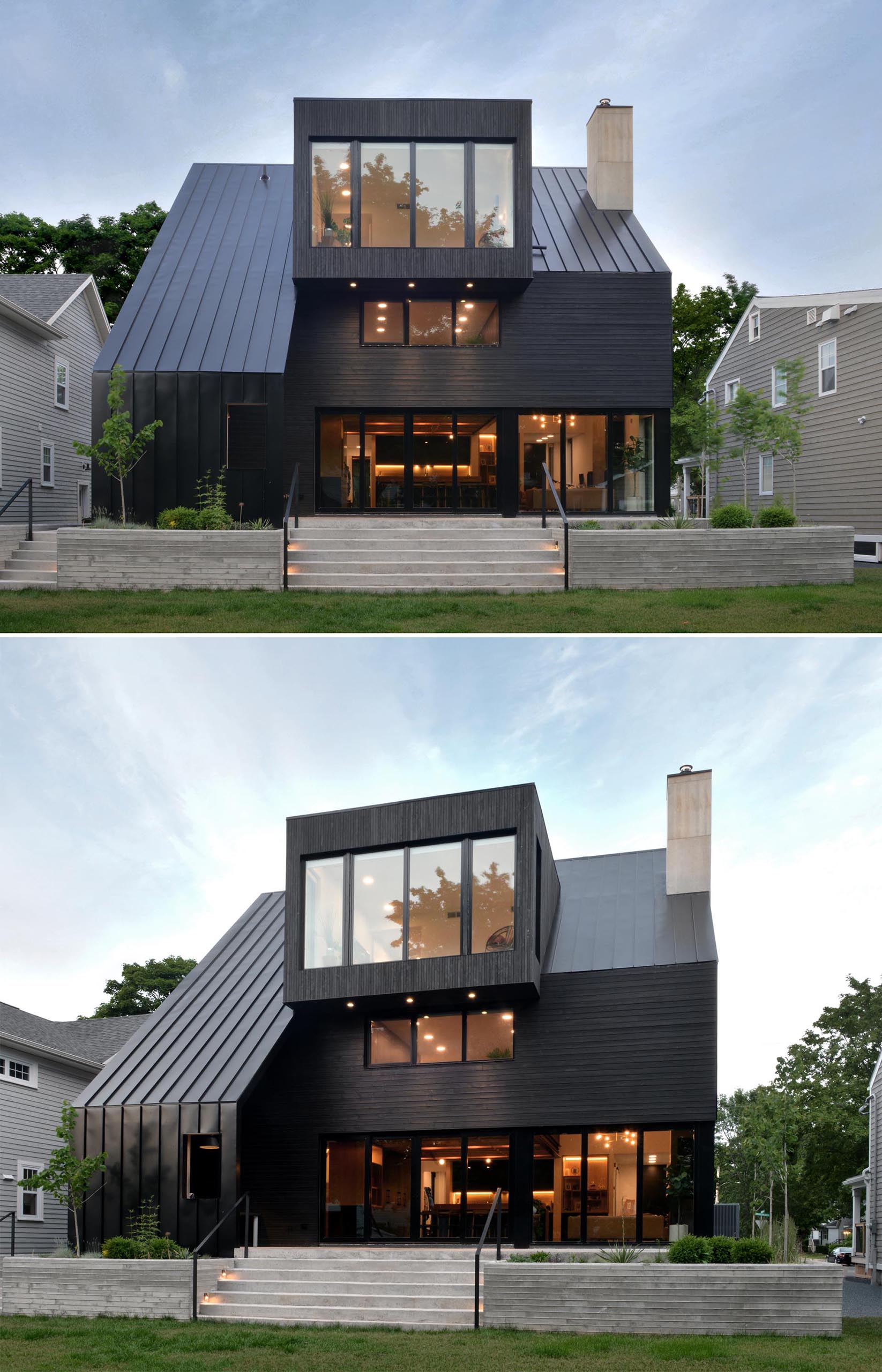 A modern black house with wood siding and a standing seam metal roof, as well as black window frames.
