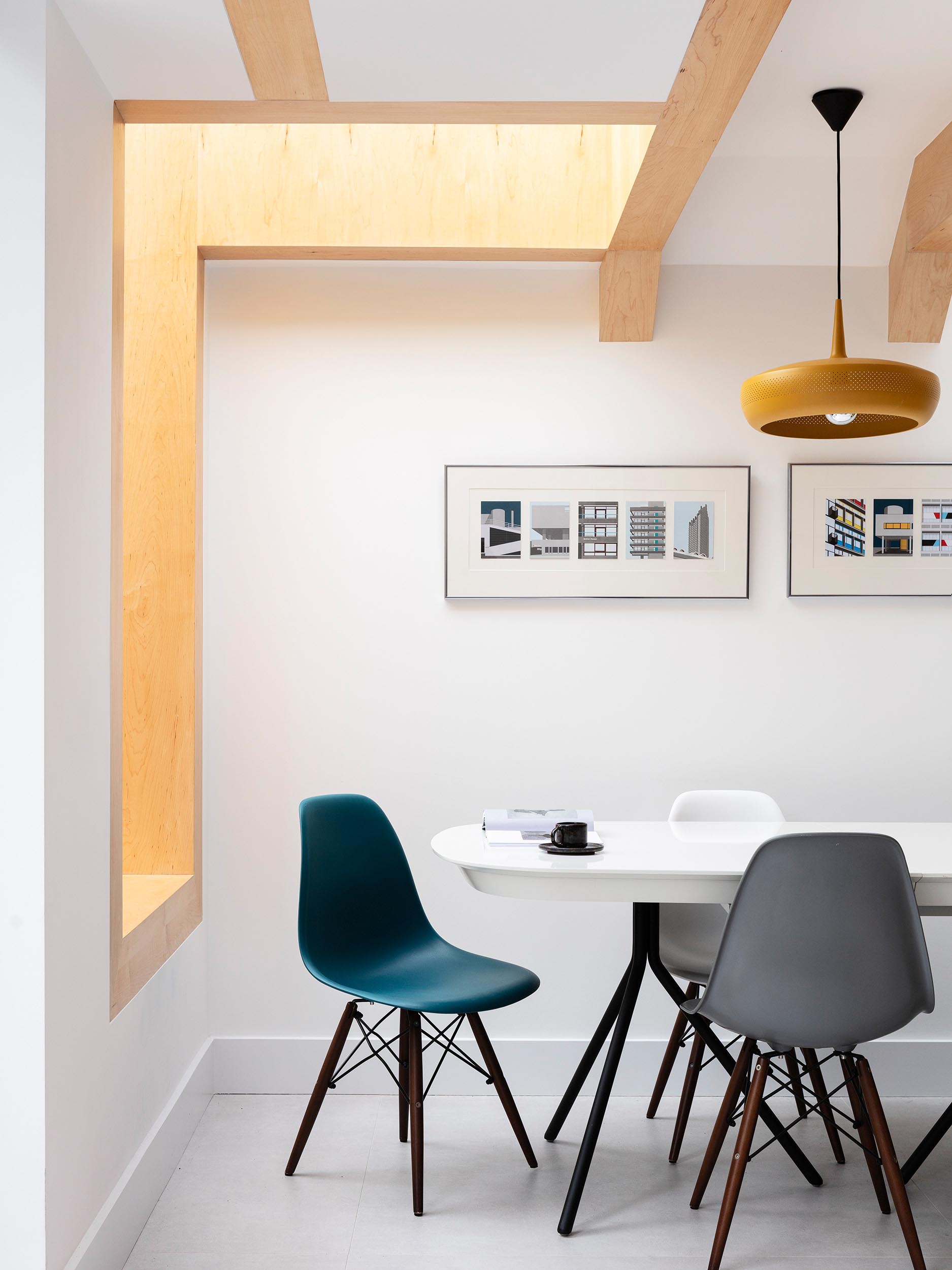 A deep set window seat lined with the same Oak wood as the beams,  has views of a fish pond.