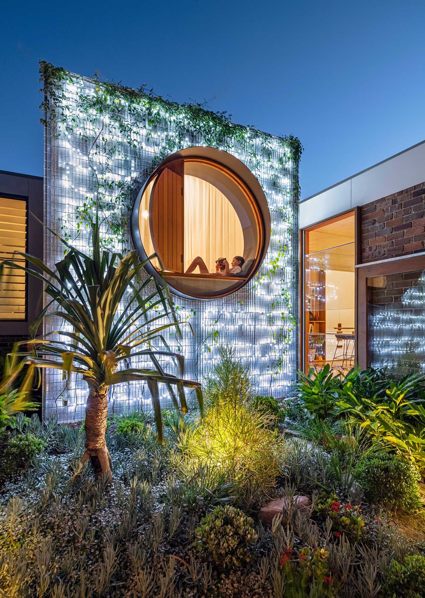 At night, this wall is lit from behind, creating an outdoor focal point that also helps to light up the nearby patio.