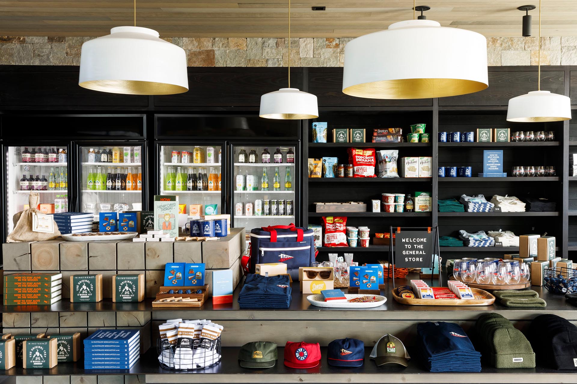 A modern general store that carries a variety of items like drinks, souvenirs, and snacks.