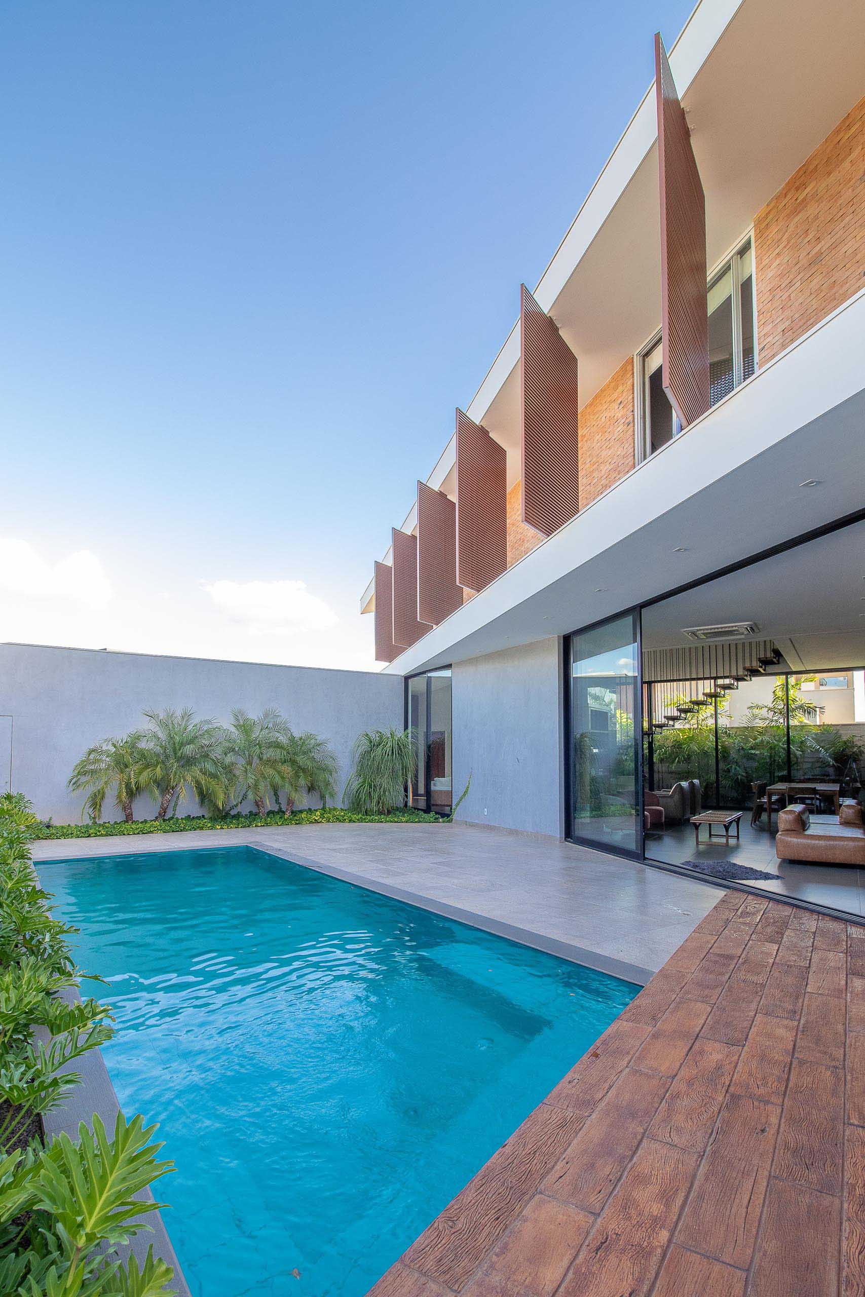 A modern house with a swimming pool and patio.