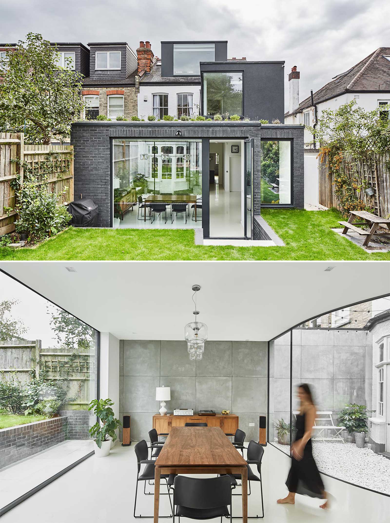 A modern rear extension with a curved window creates space for a small courtyard and protects the original bay window.