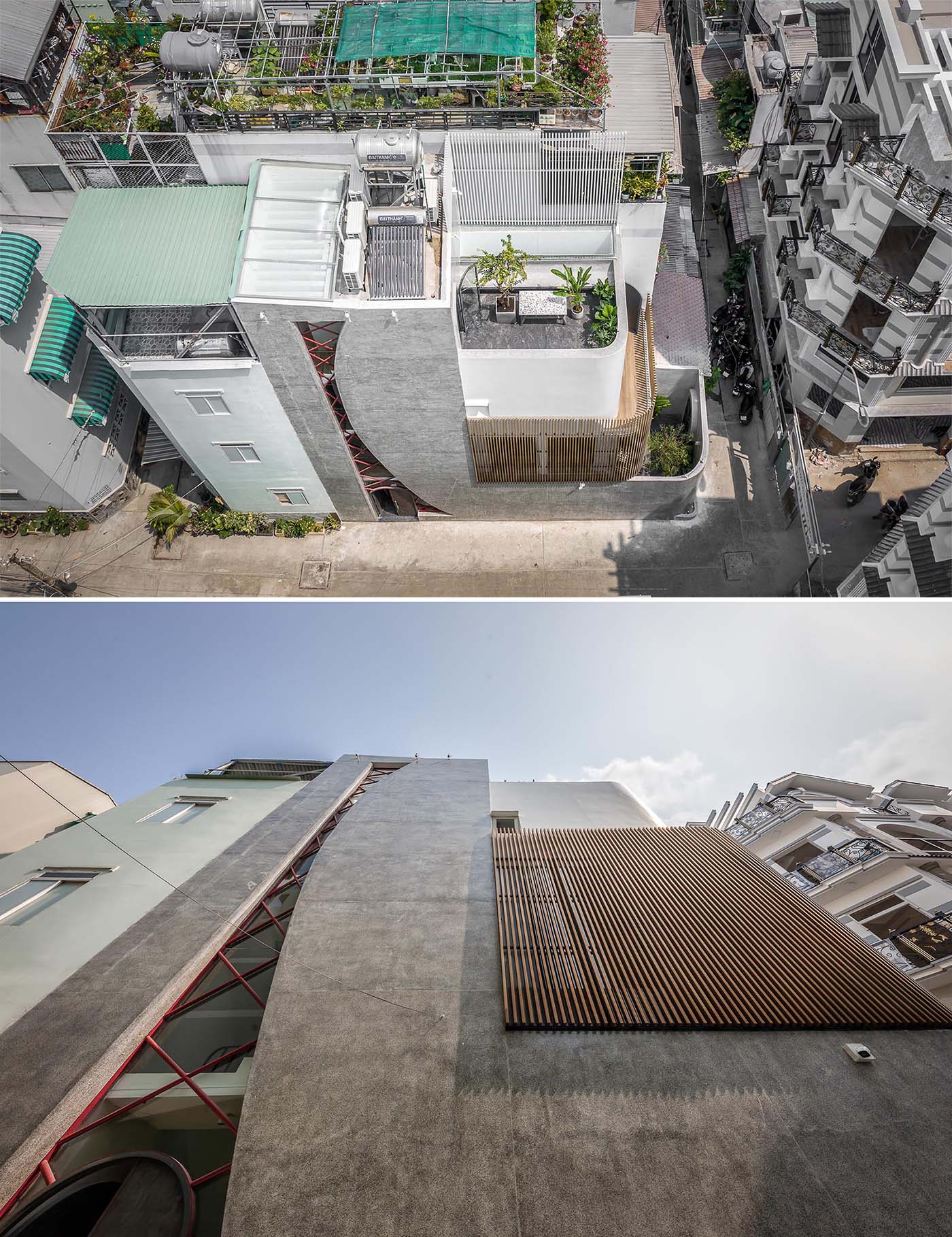 A modern concrete house with an irregular shaped window, also incorporates the steel arched front door.