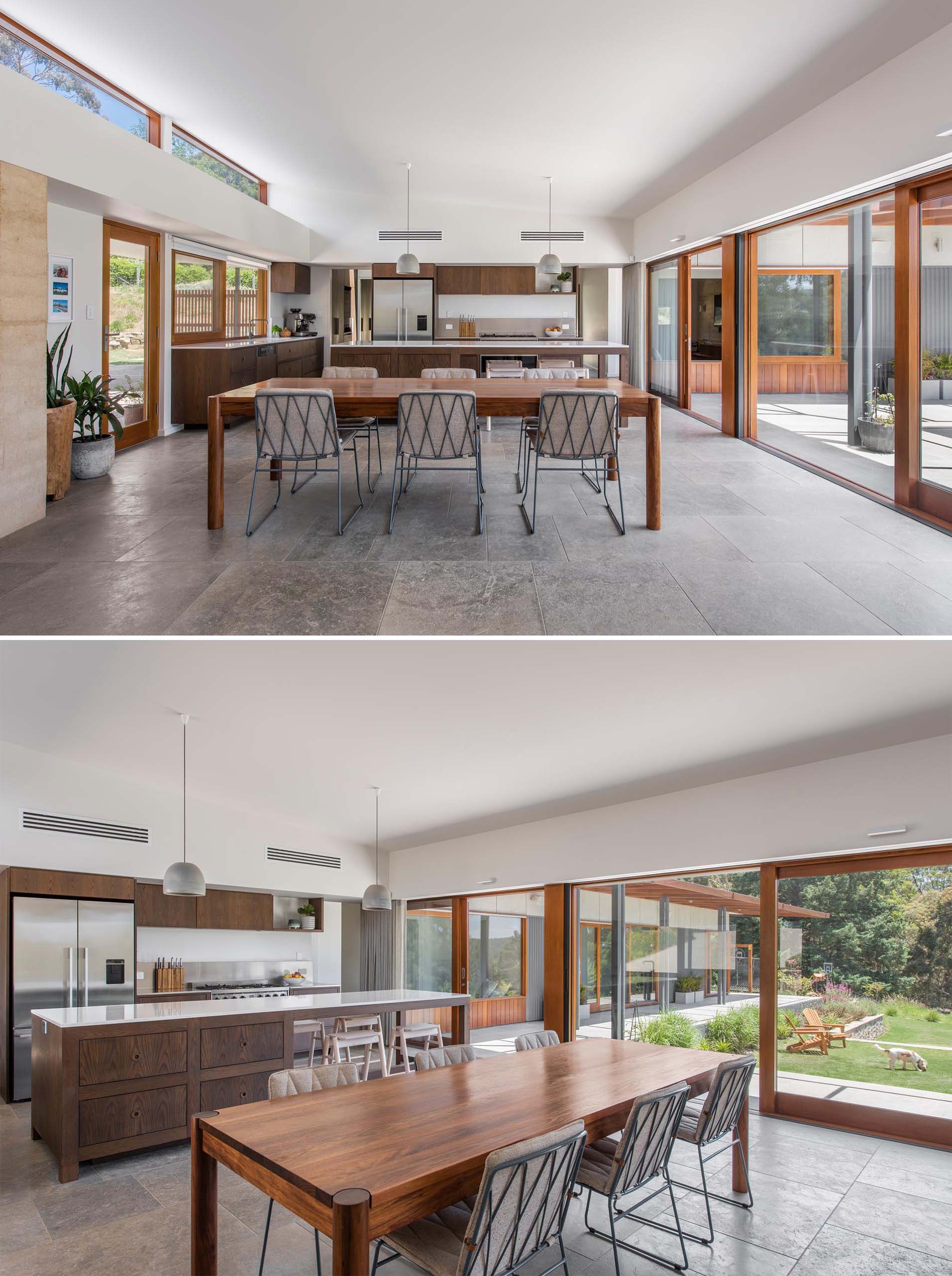 A modern interior with an open plan kitchen, dining and living area, which has an immediate relationship with the outdoor entertaining space, and can be accessed through the wood framed sliding glass doors.